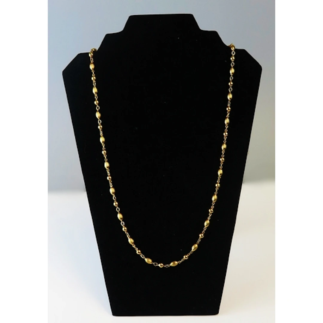 A 9ct yellow gold fancy bead necklace by UnoAErre, 70cm long...