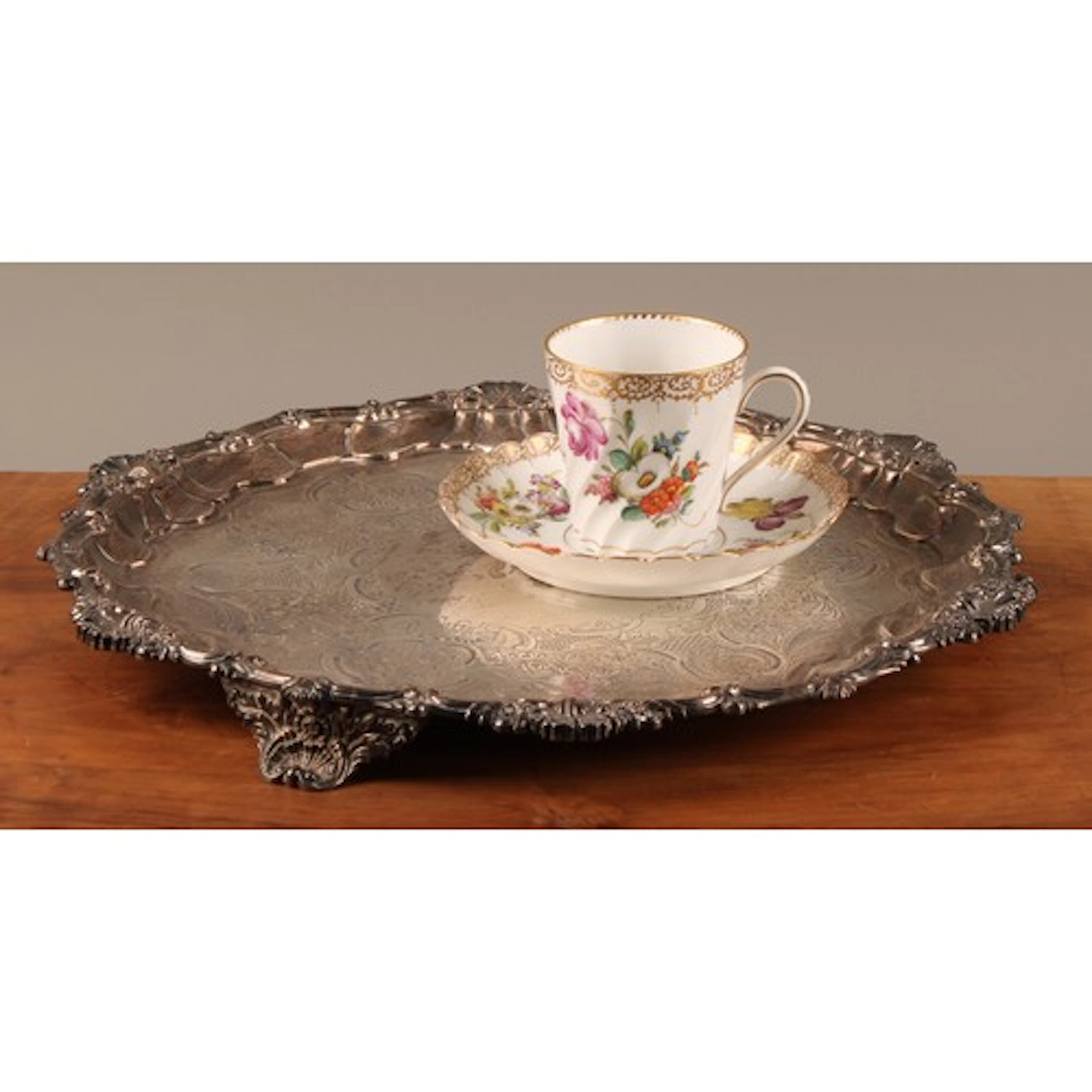 A George IV silver shaped circular tray, moulded scalloped s...
