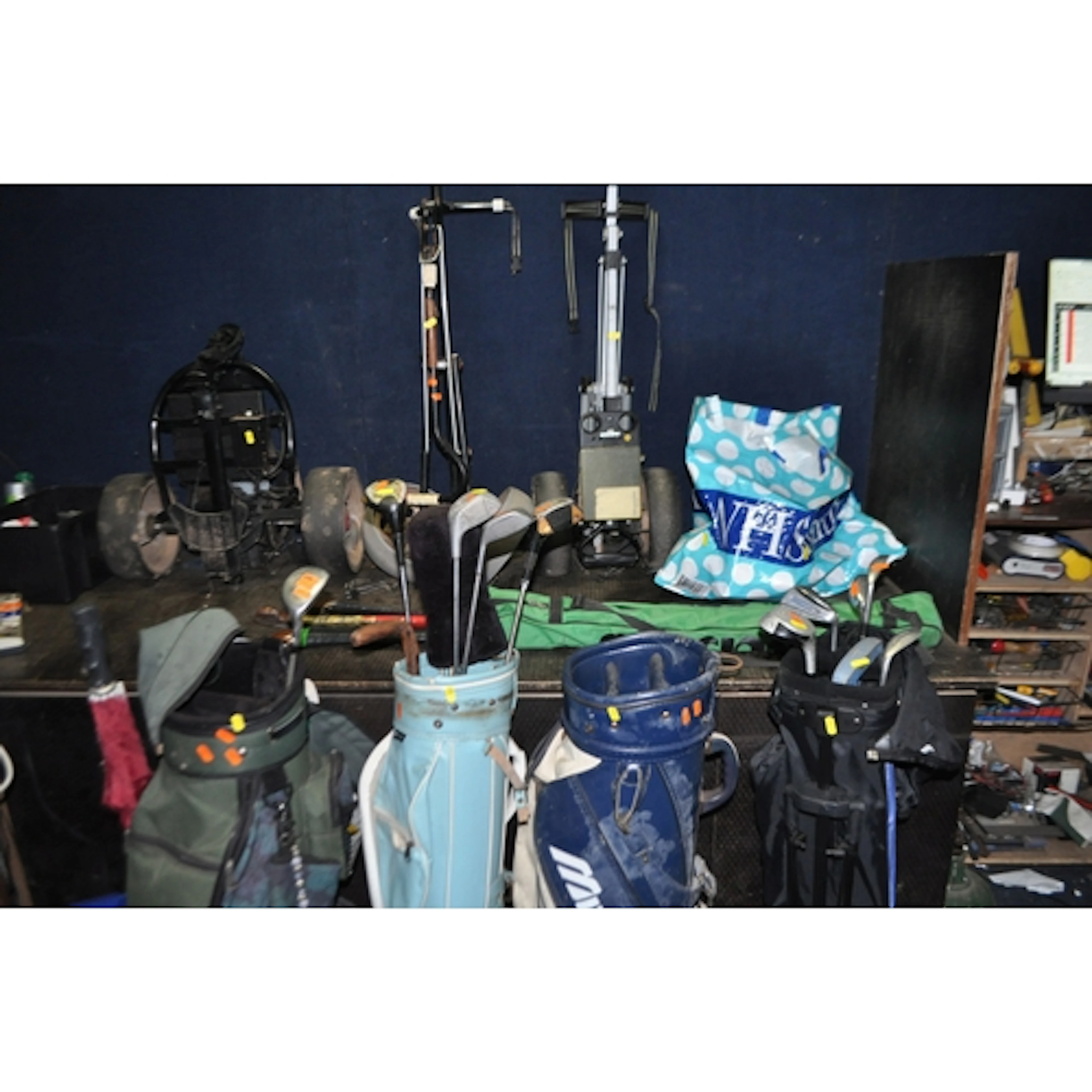 A COLLECTION OF SPORTING GOODS including four golf bags incl...