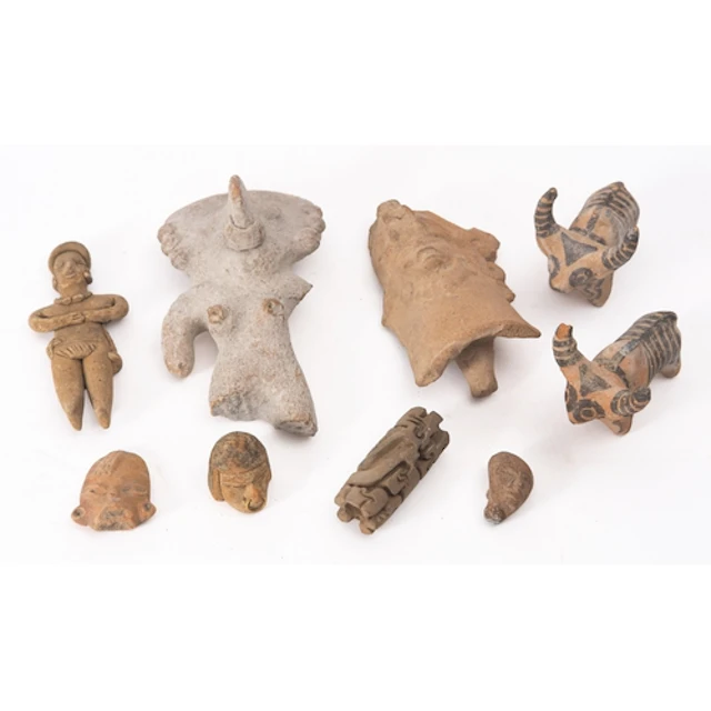 A collection of Pre-Columbian terracotta heads (one in form ...