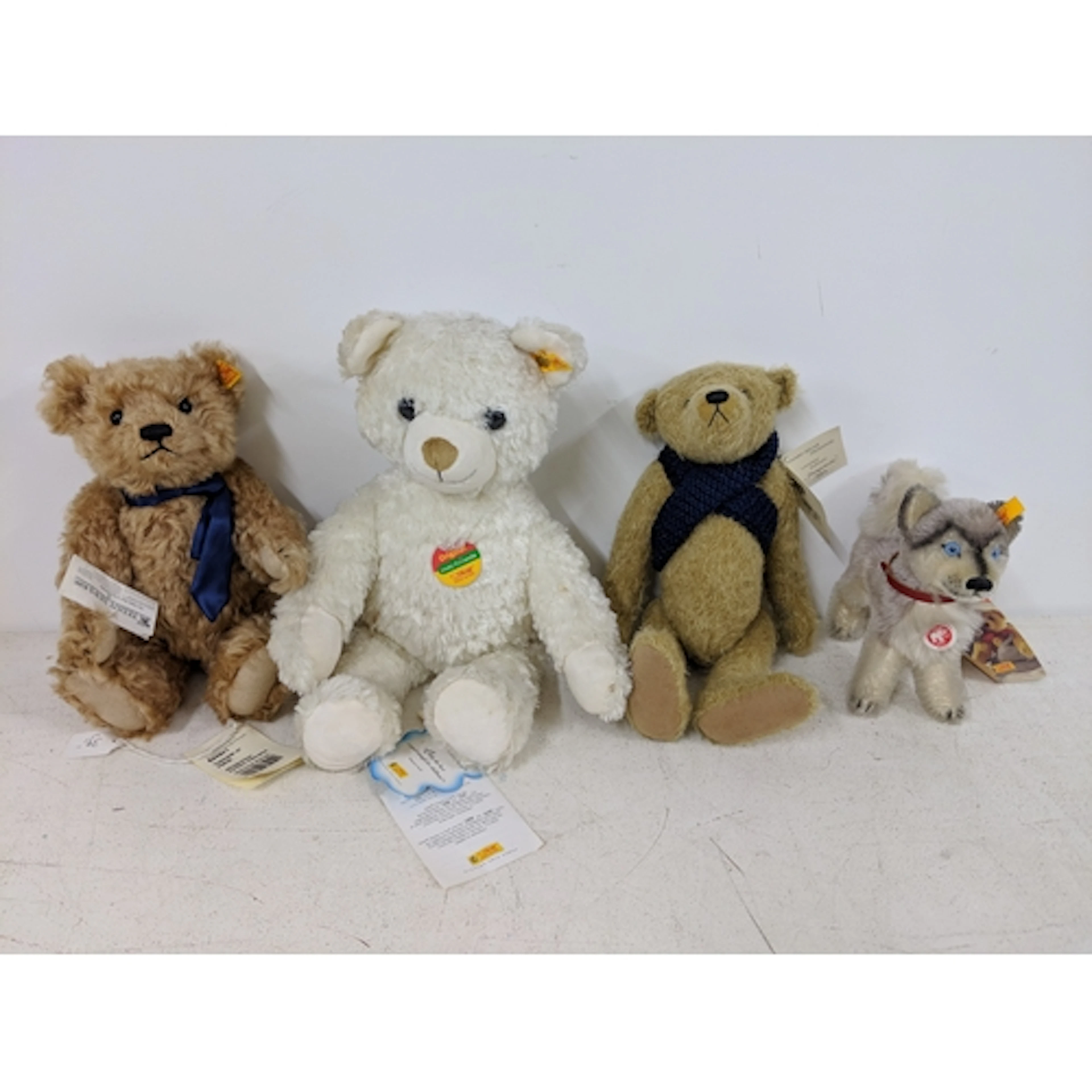 Three Steiff toys, three bears and one dog to include Husky,...
