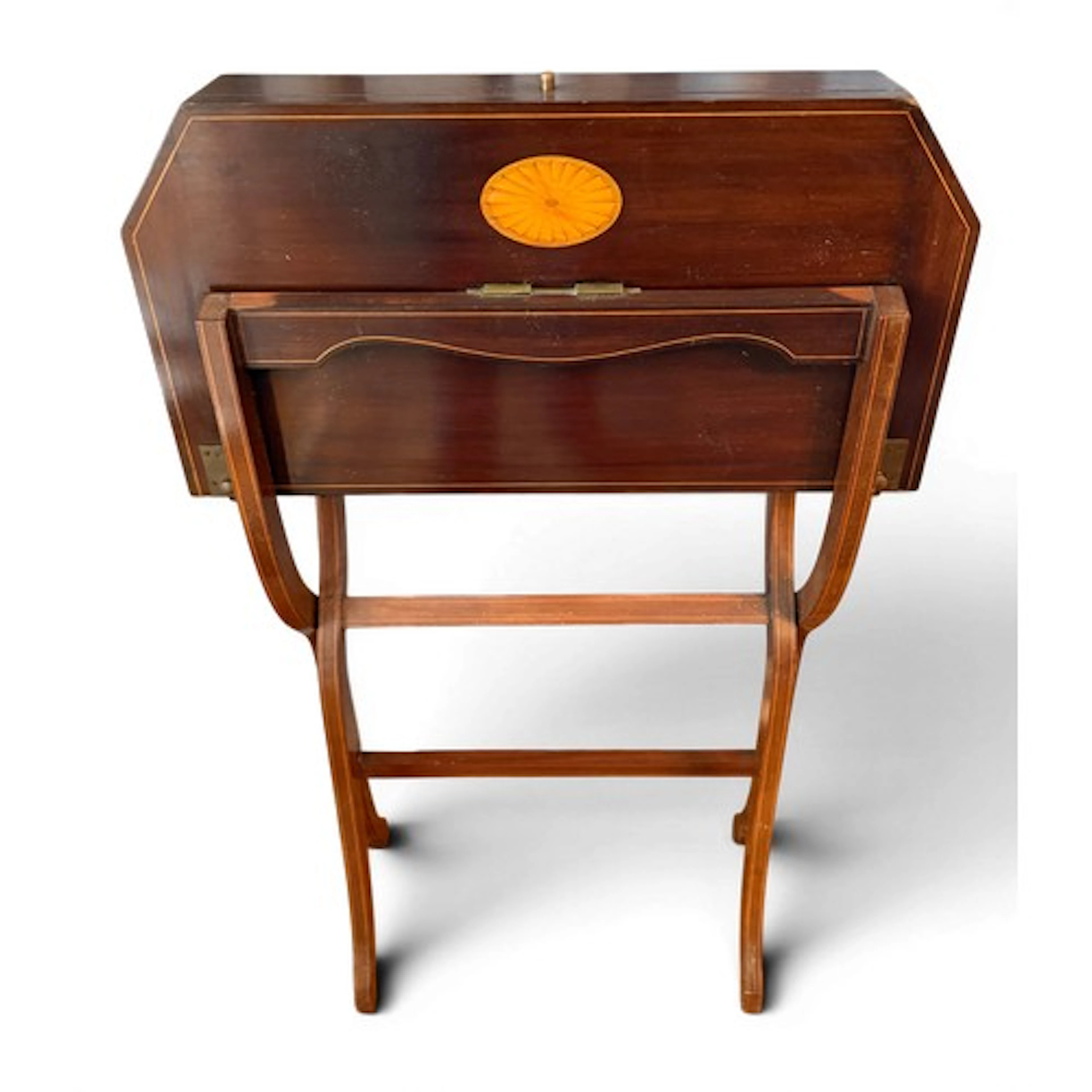 An Edwardian mahogany inlaid folding writing desk with fitte...