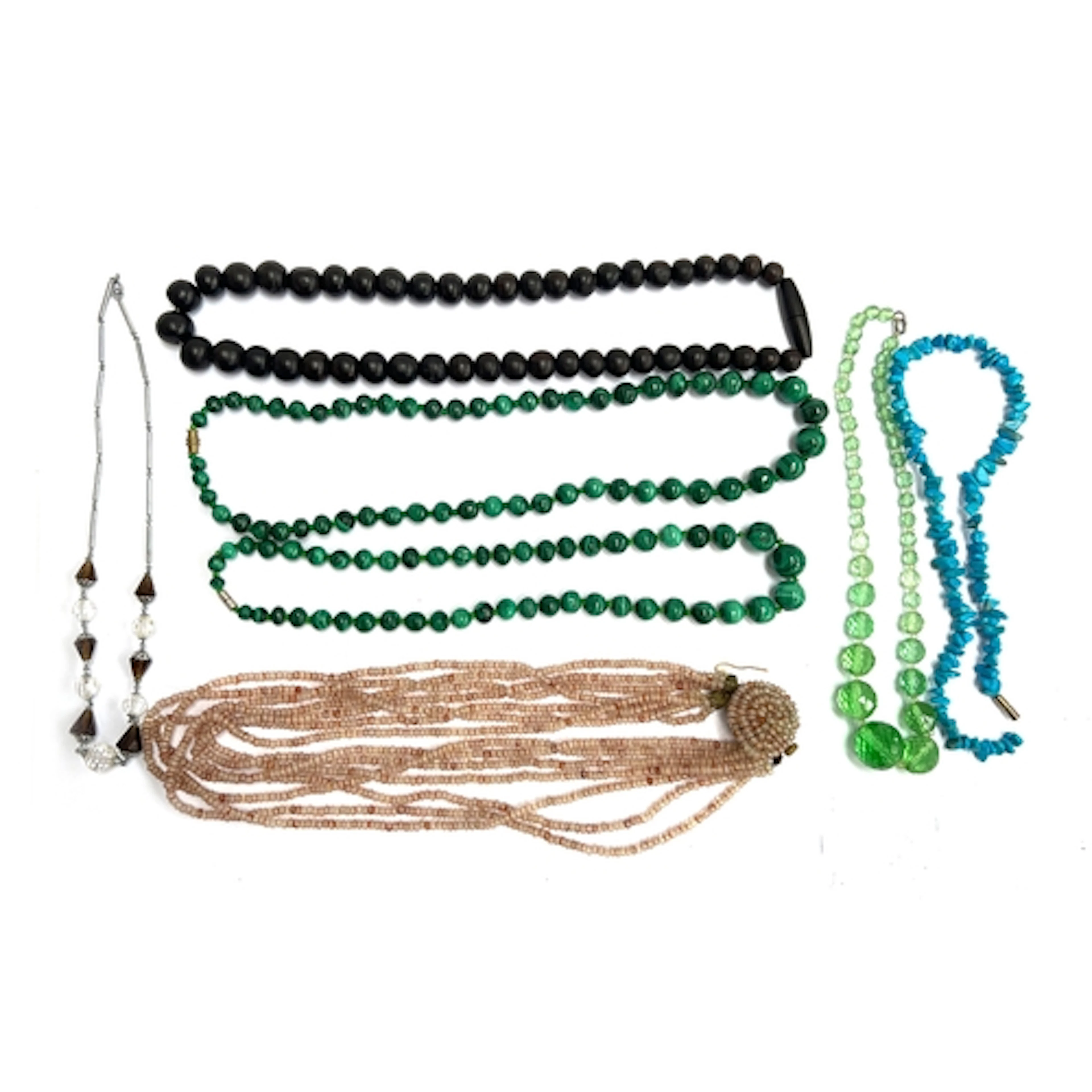 A mixed lot of beads to include malachite, ebony, glass bead...