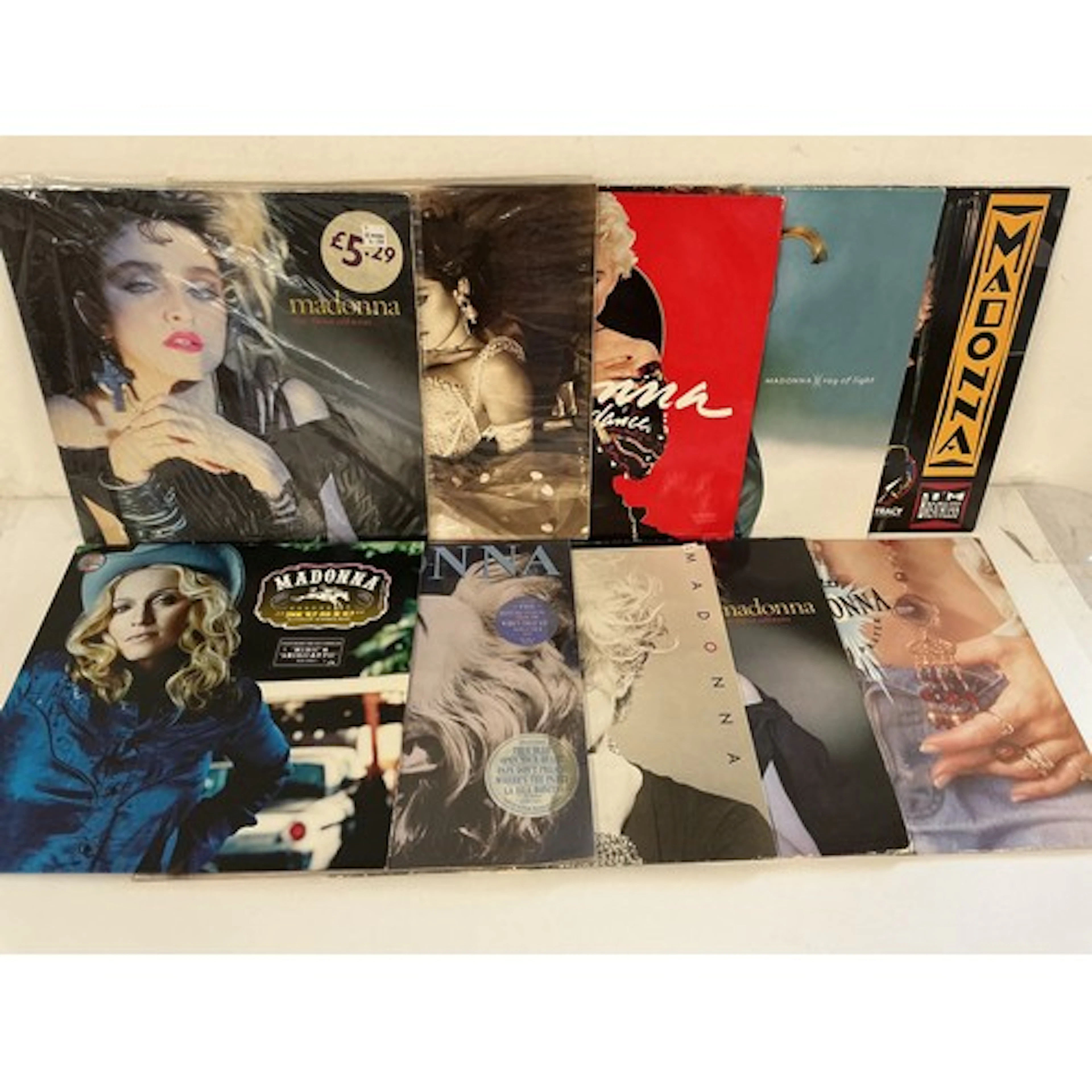 Two bags containing twenty Madonna LPs and 12” singles compr...