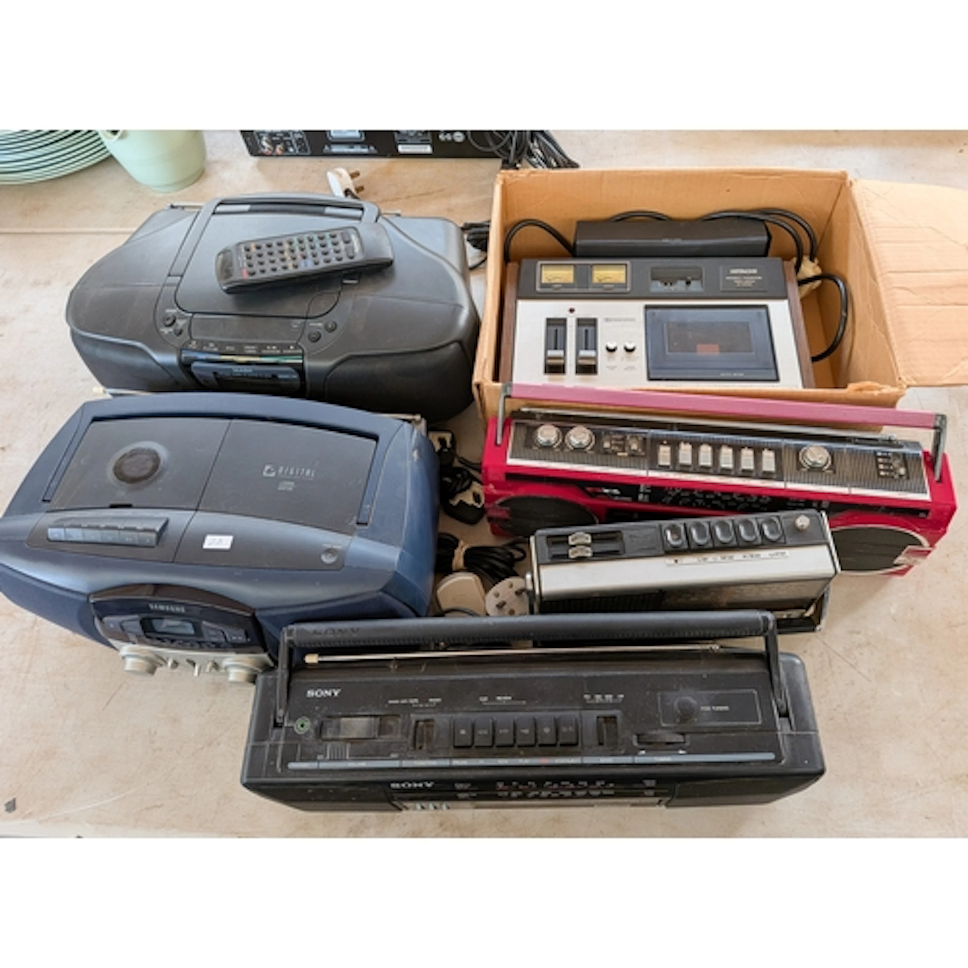 A vintage Hitachi stereo cassette tape deck together with fi...