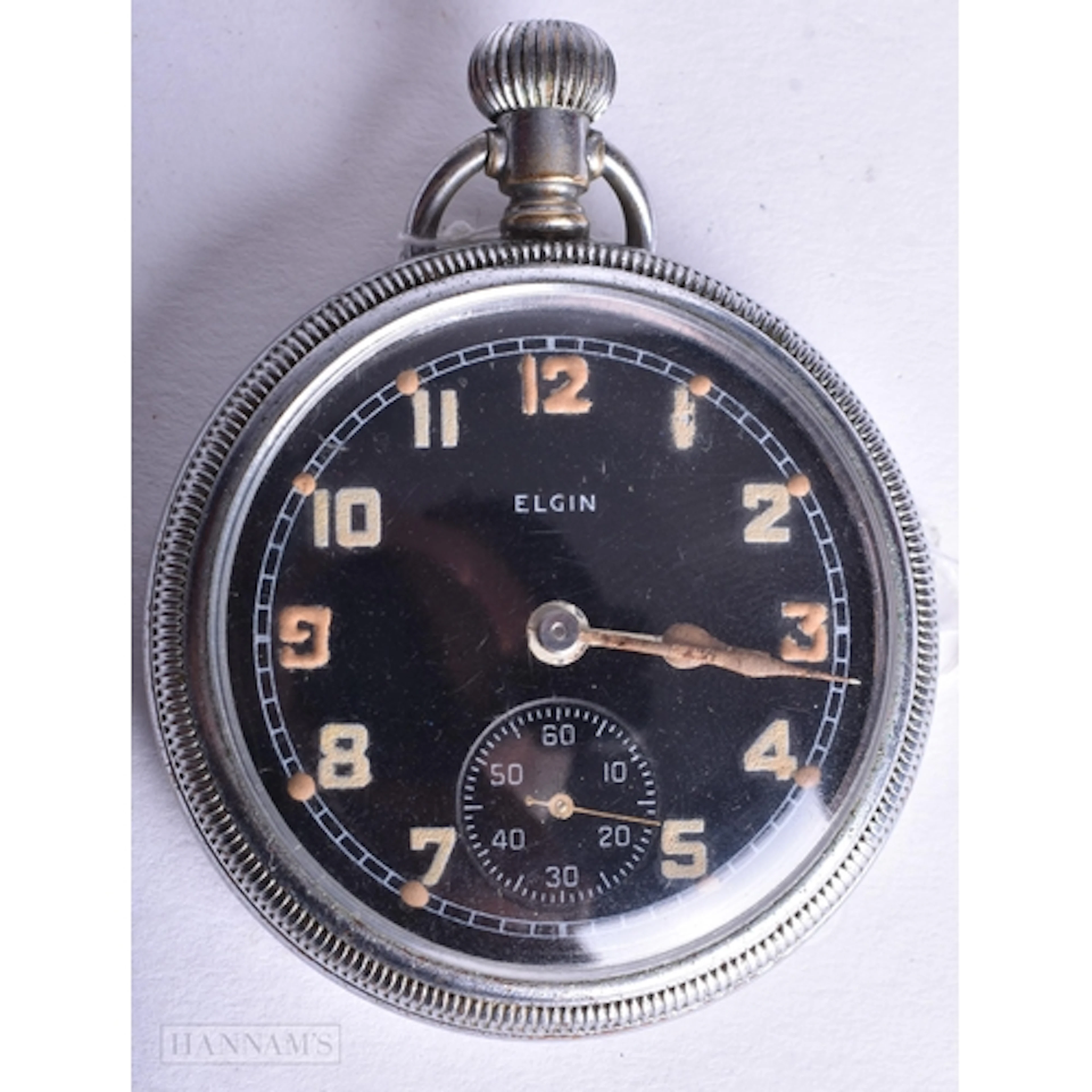 AN ELGIN MILITARY POCKET WATCH. Running. 5 cm wide.