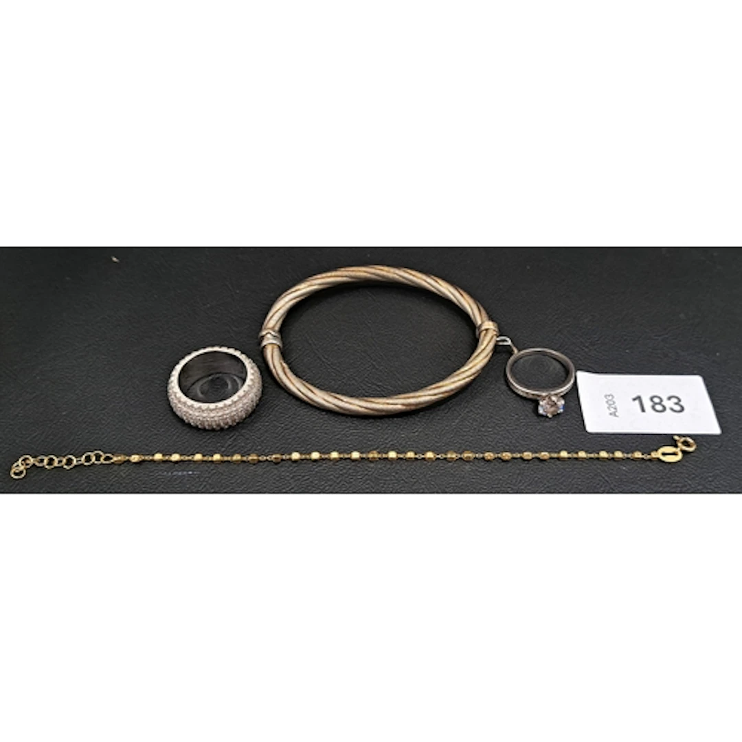 FOUR PIECES OF SILVER JEWELLERY comprising a twist design ba...