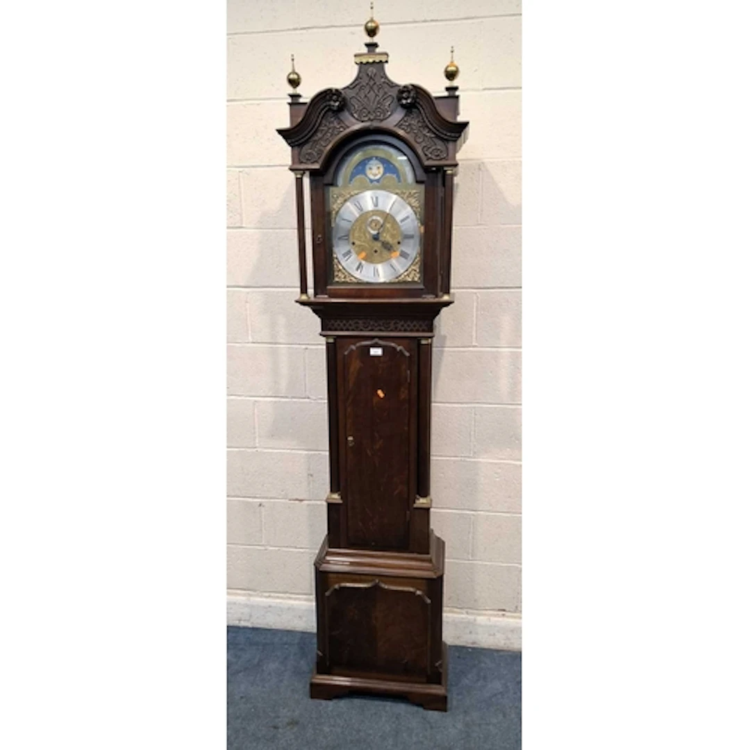 A REPRODUCTION MAHOGANY LONGCASE CLOCK, with three brass fin...