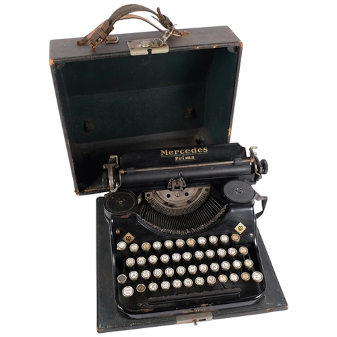 An Antique Mercedes Prima portable typewriter with case