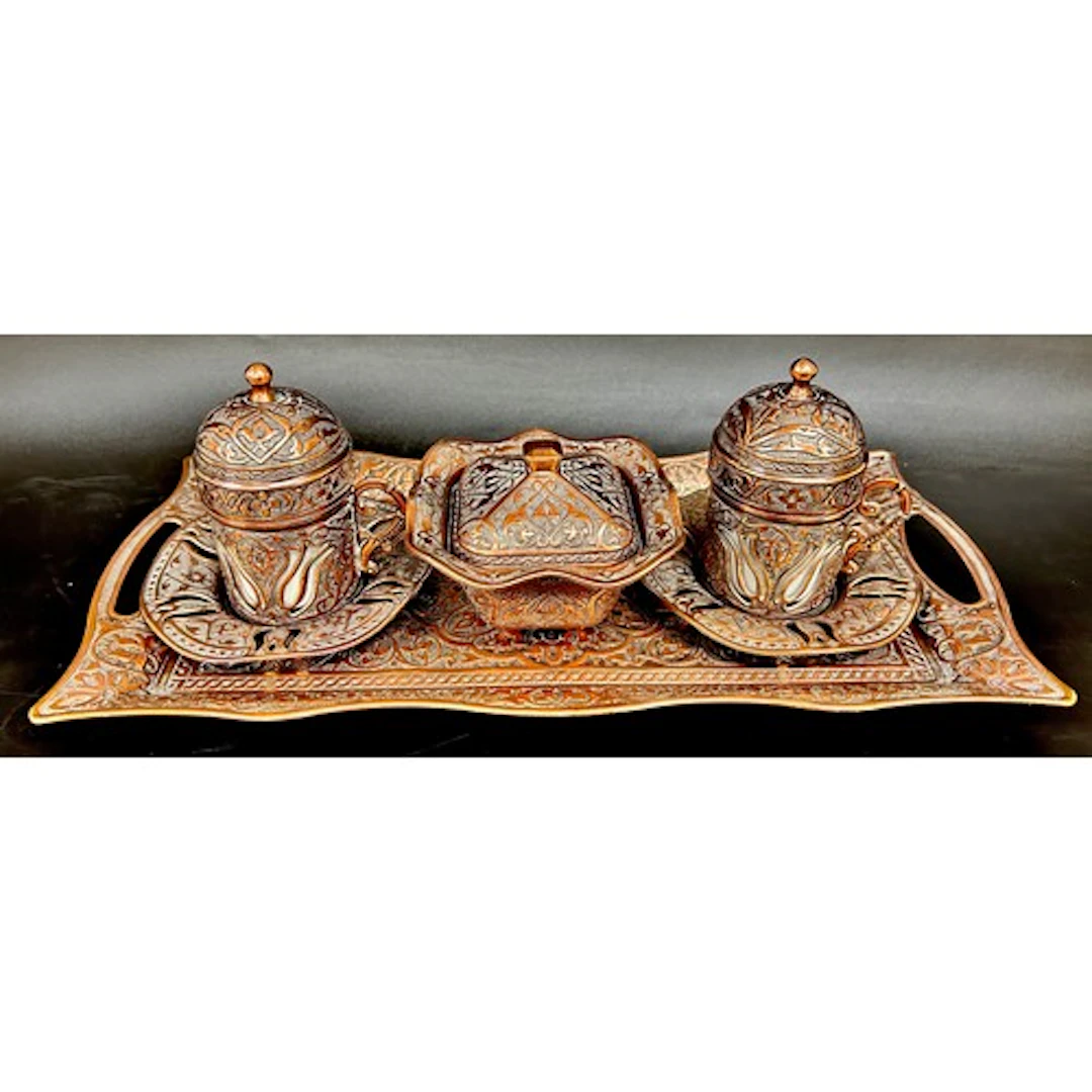 A copper Turkish style coffee set with tray and sugar pot ma...
