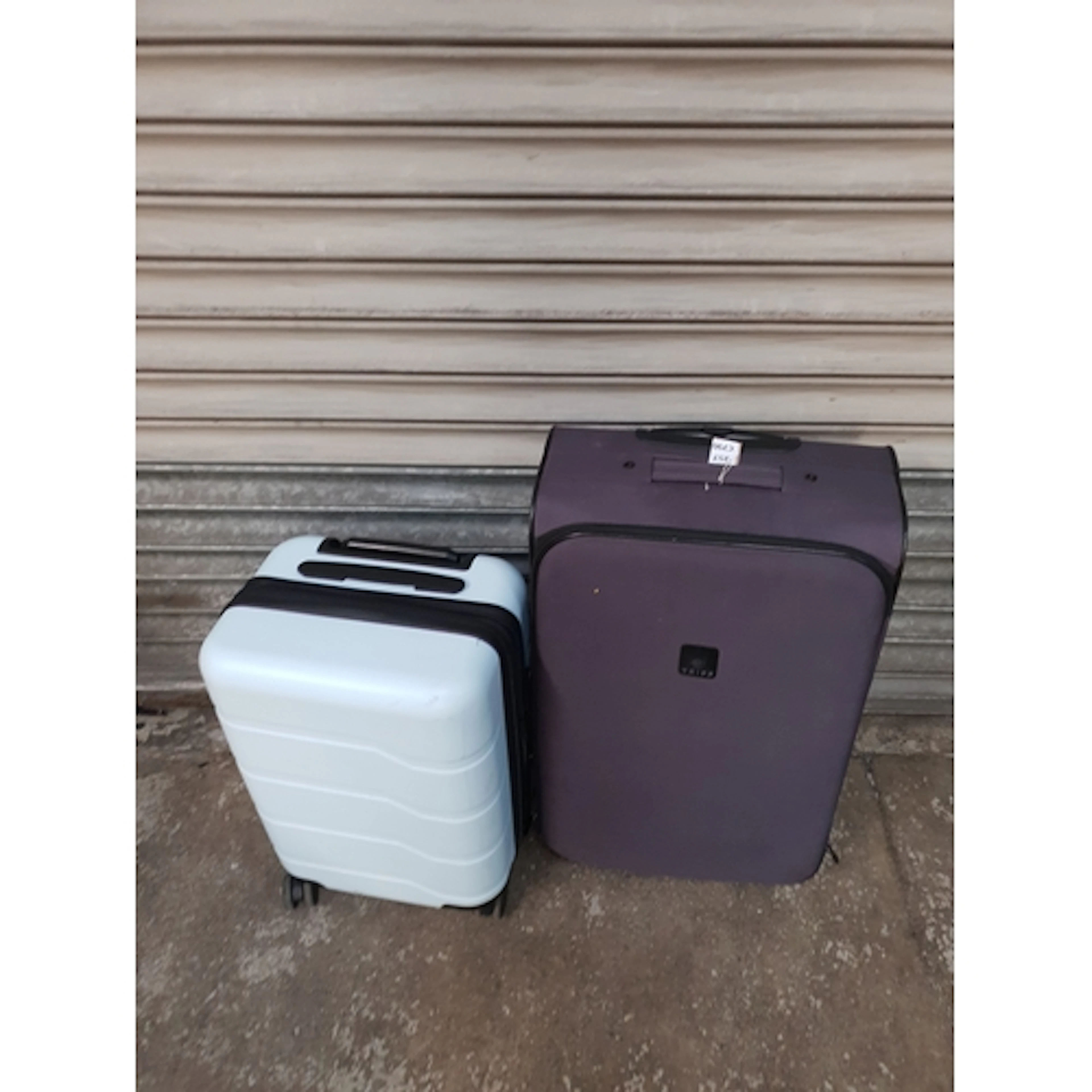 TWO SUITCASES including Tripp Note: cases and bags are empty