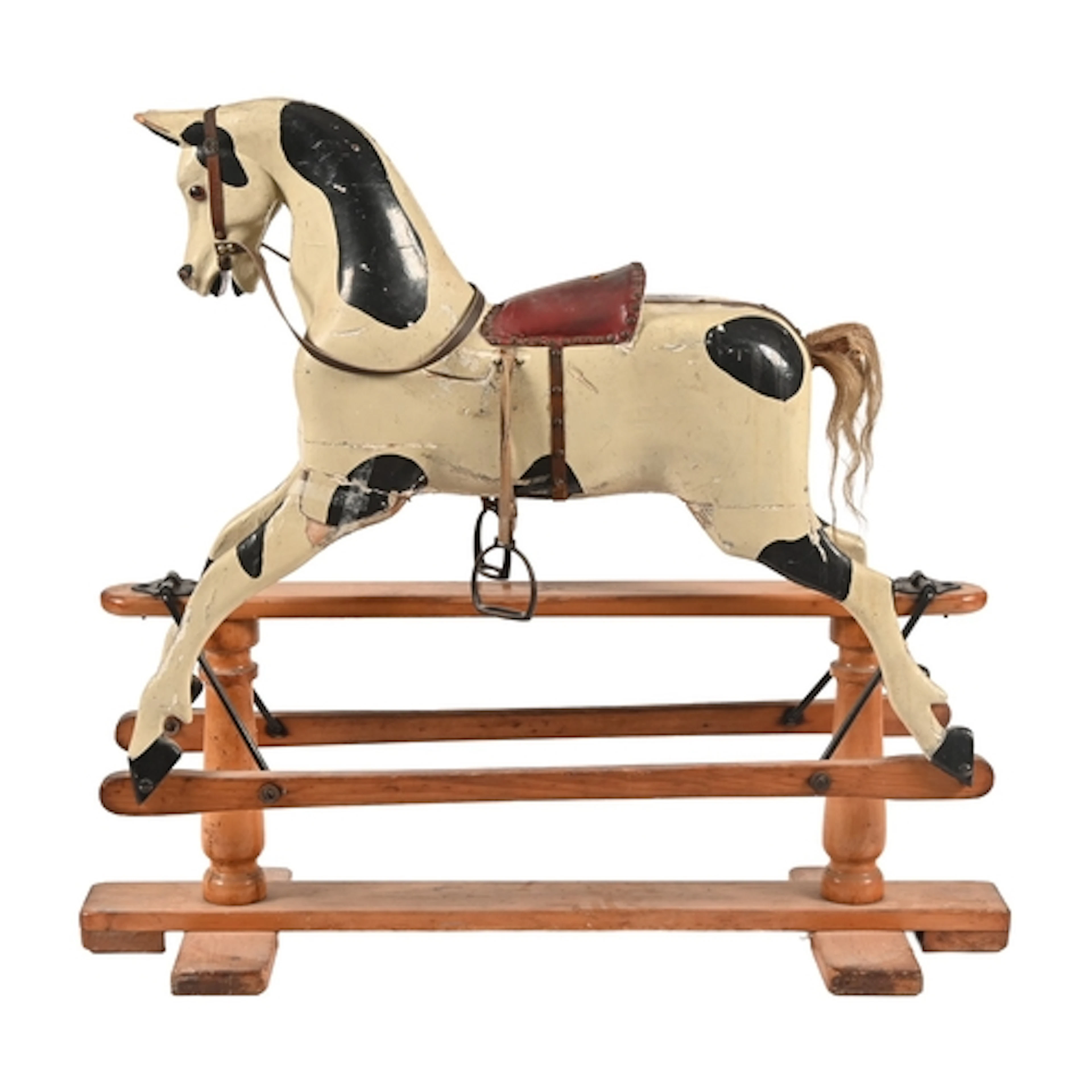 A painted rocking horse, early 20th c, with glass eyes, late...