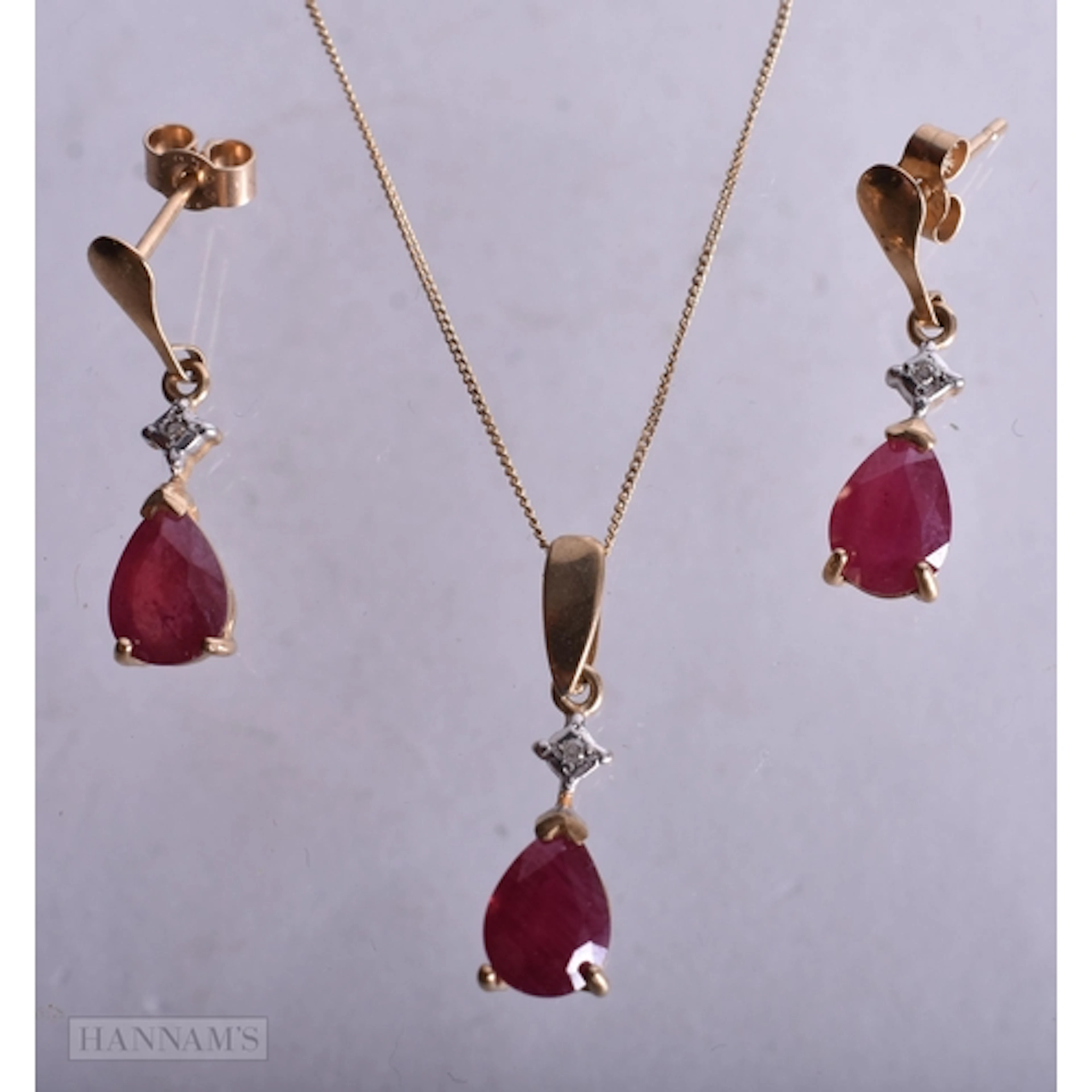 9ct ruby and diamond drop earrings and necklace set (2.6g). ...