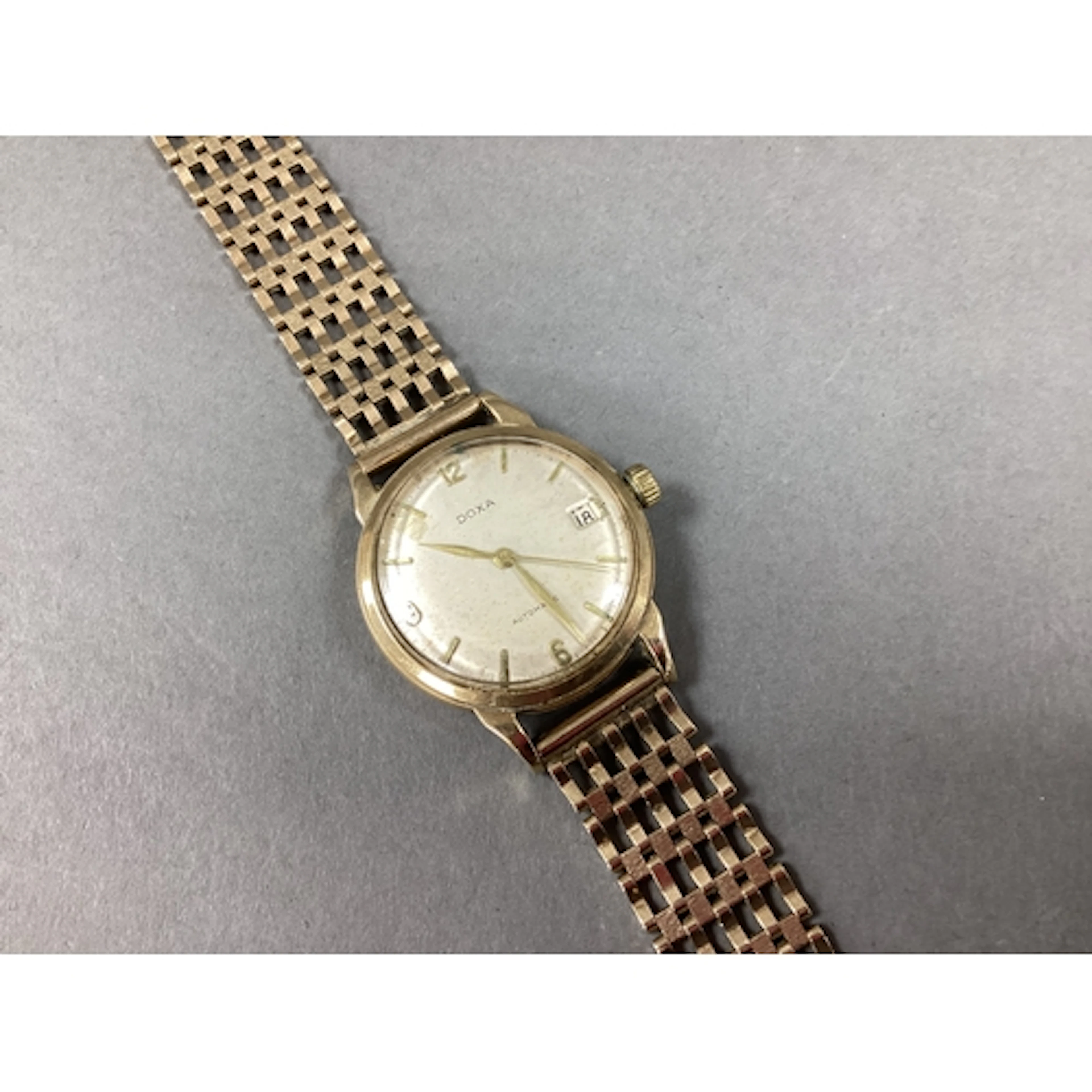 Doxa Automatic; A 9ct Gold Cased Gent's Wristwatch, the circ...