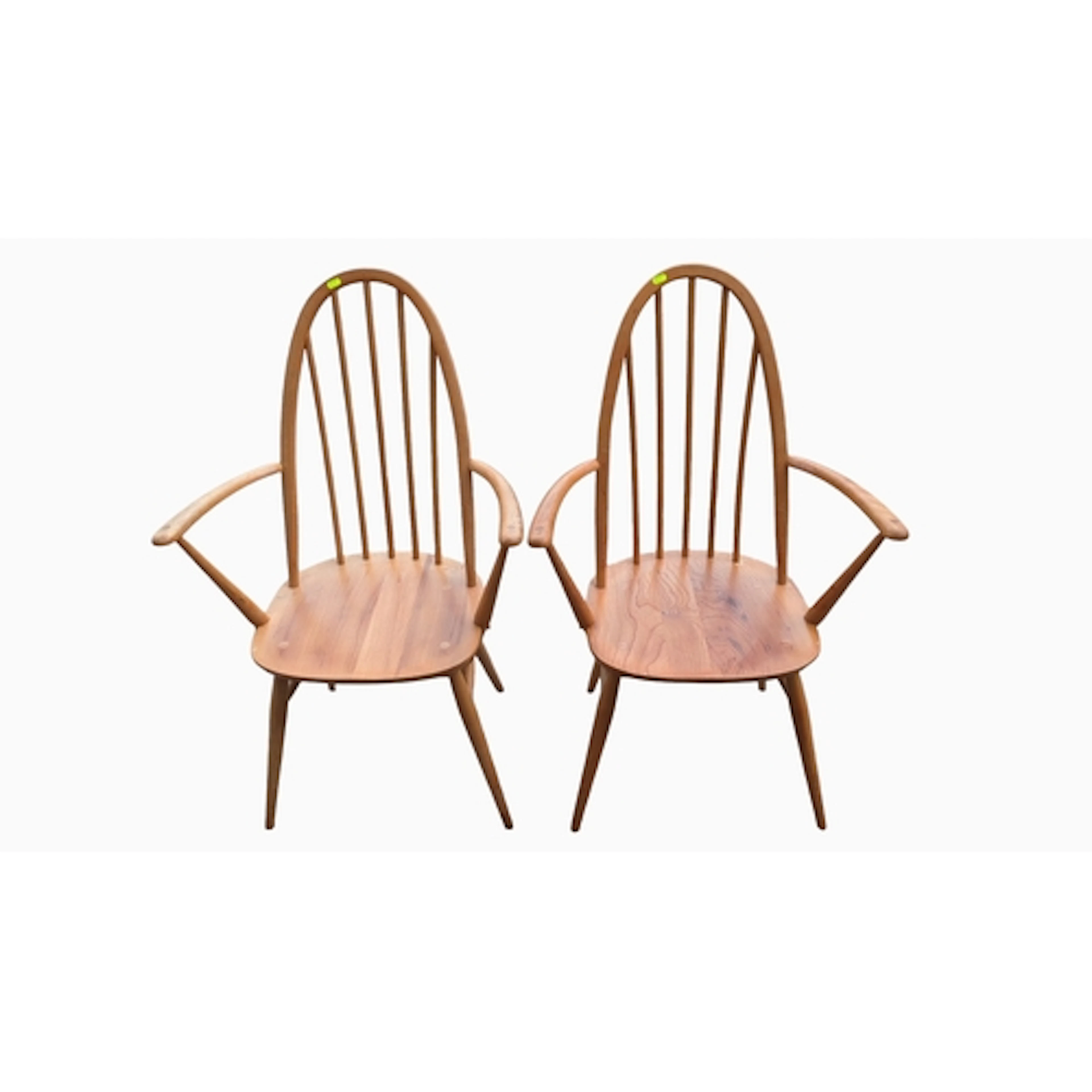 Ercol, a pair of elm and beech Windsor armchairs, each with ...