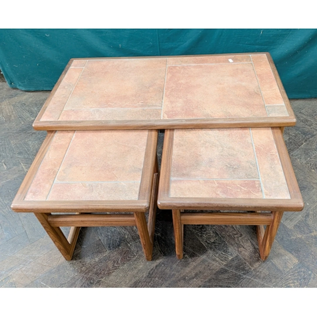 Nest of three tiled top coffee tables