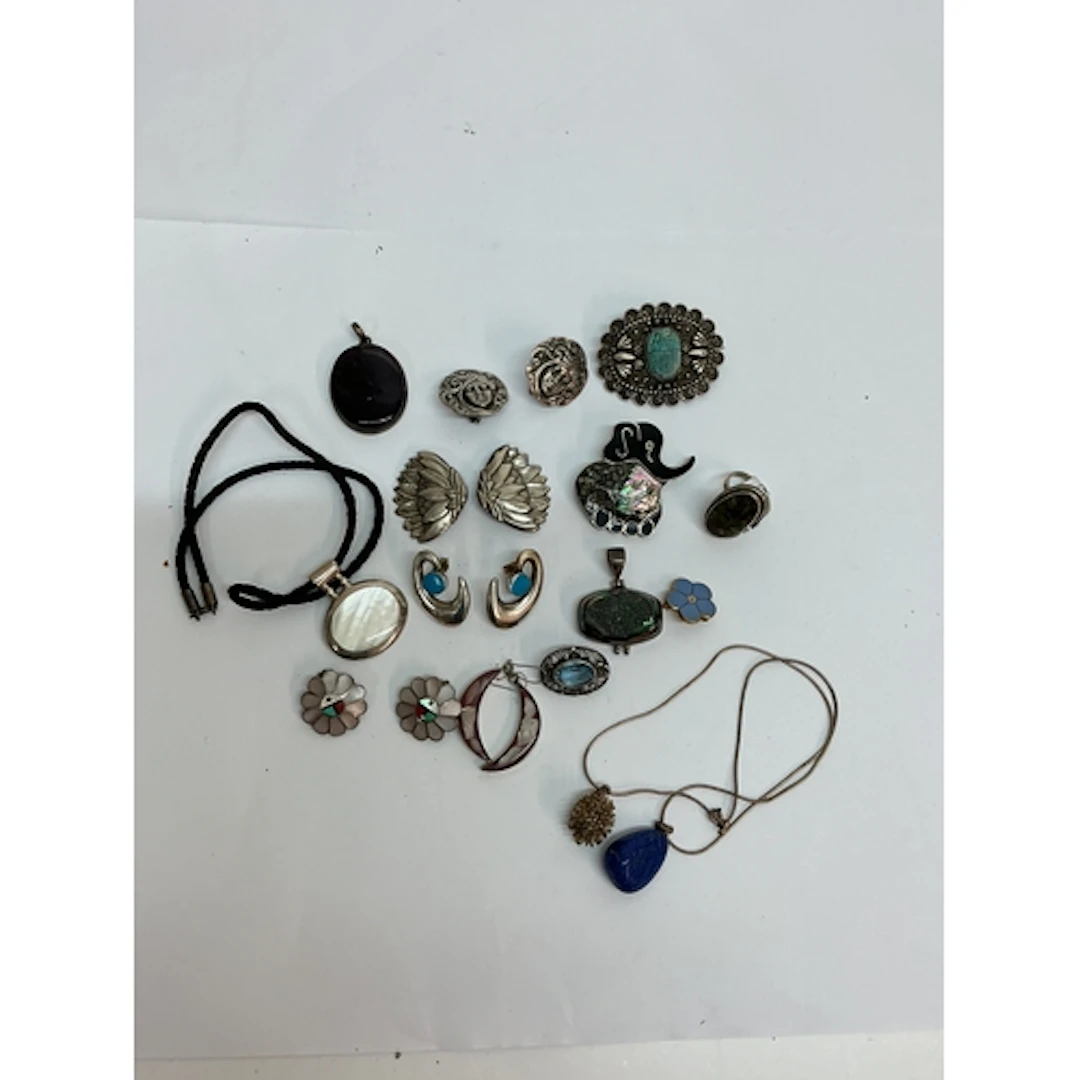 A small group of silver and white metal jewellery including ...