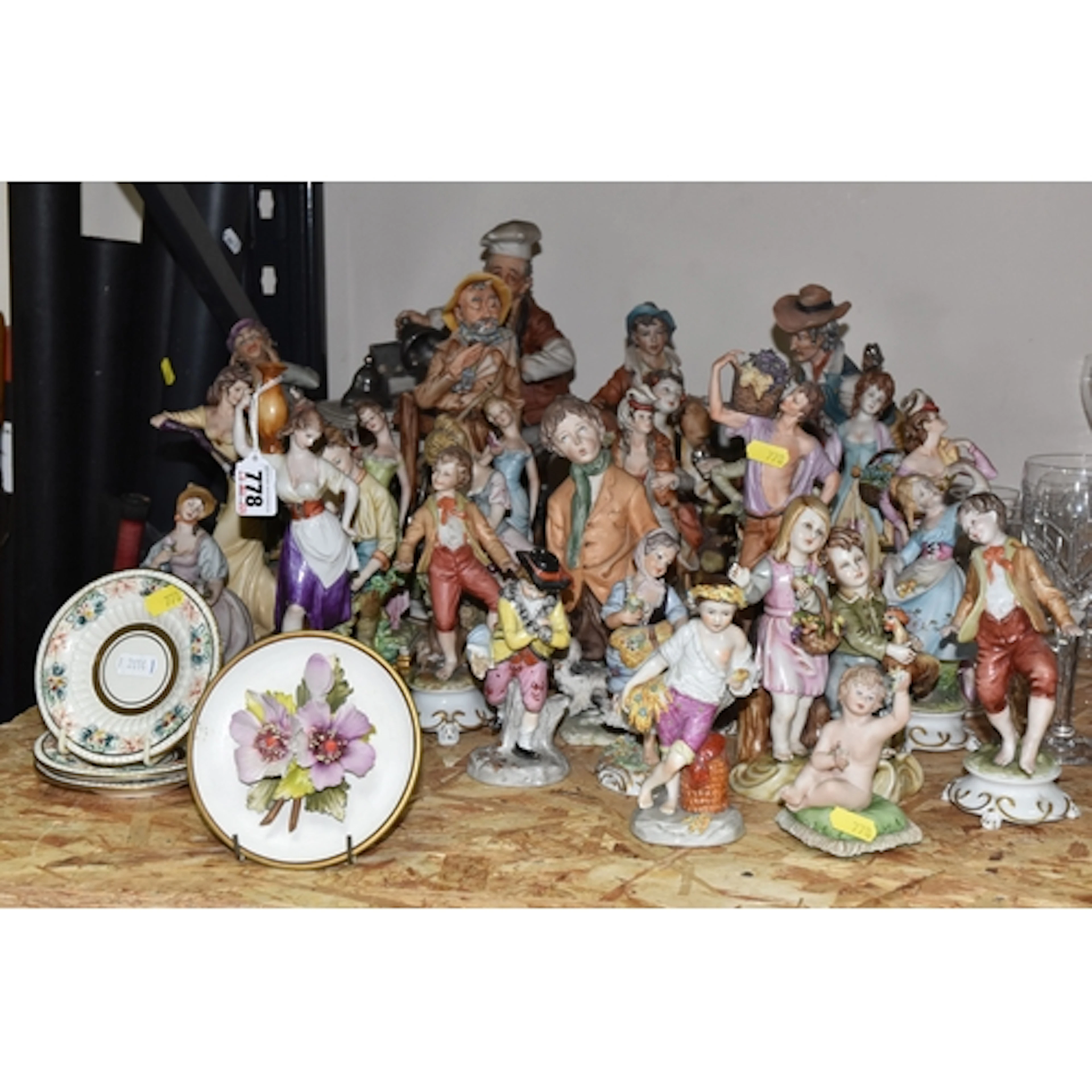 A LARGE GROUP OF CAPODIMONTE FIGURES including six glazed fi...