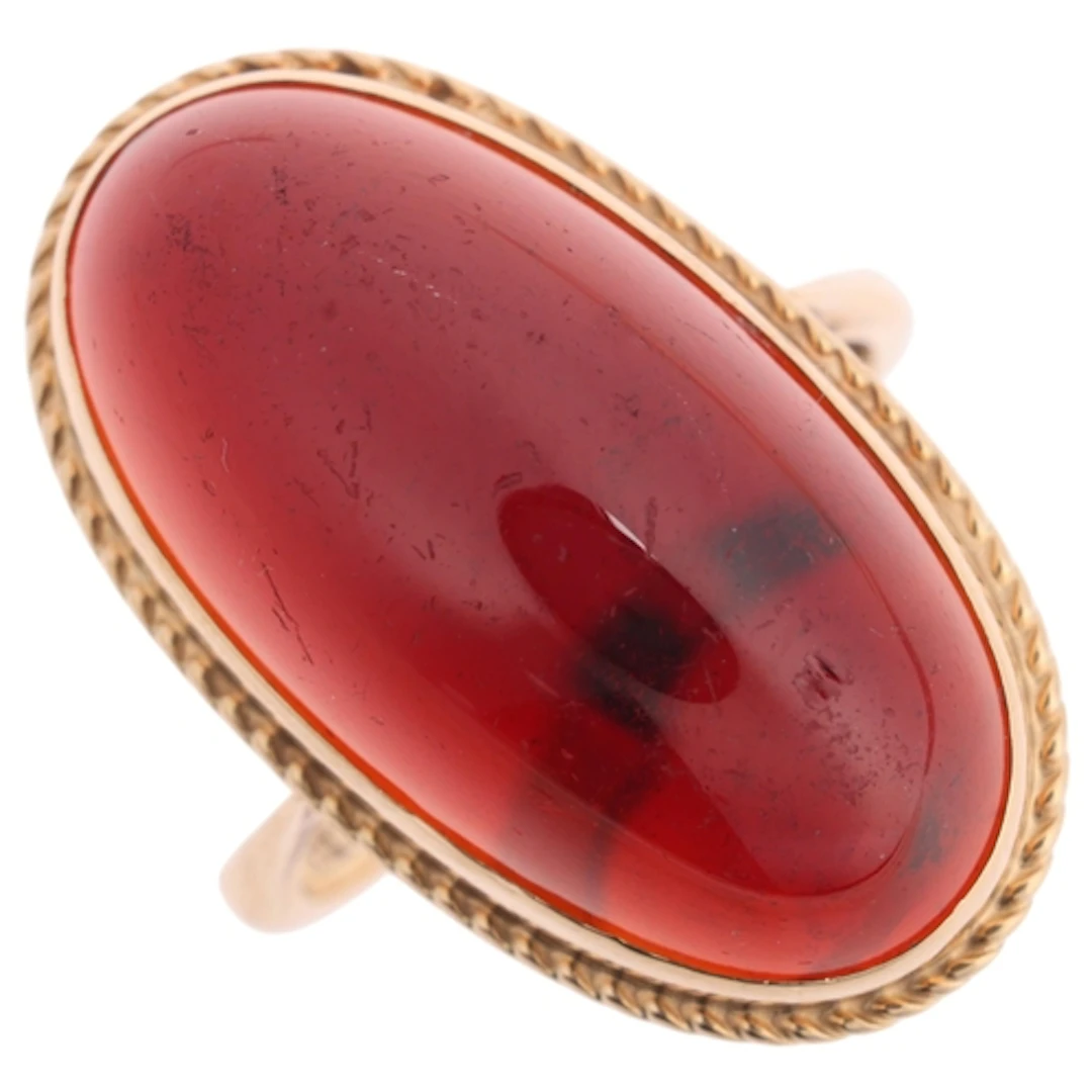 A Vintage 9ct gold garnet ring, rub-over set with oval caboc...
