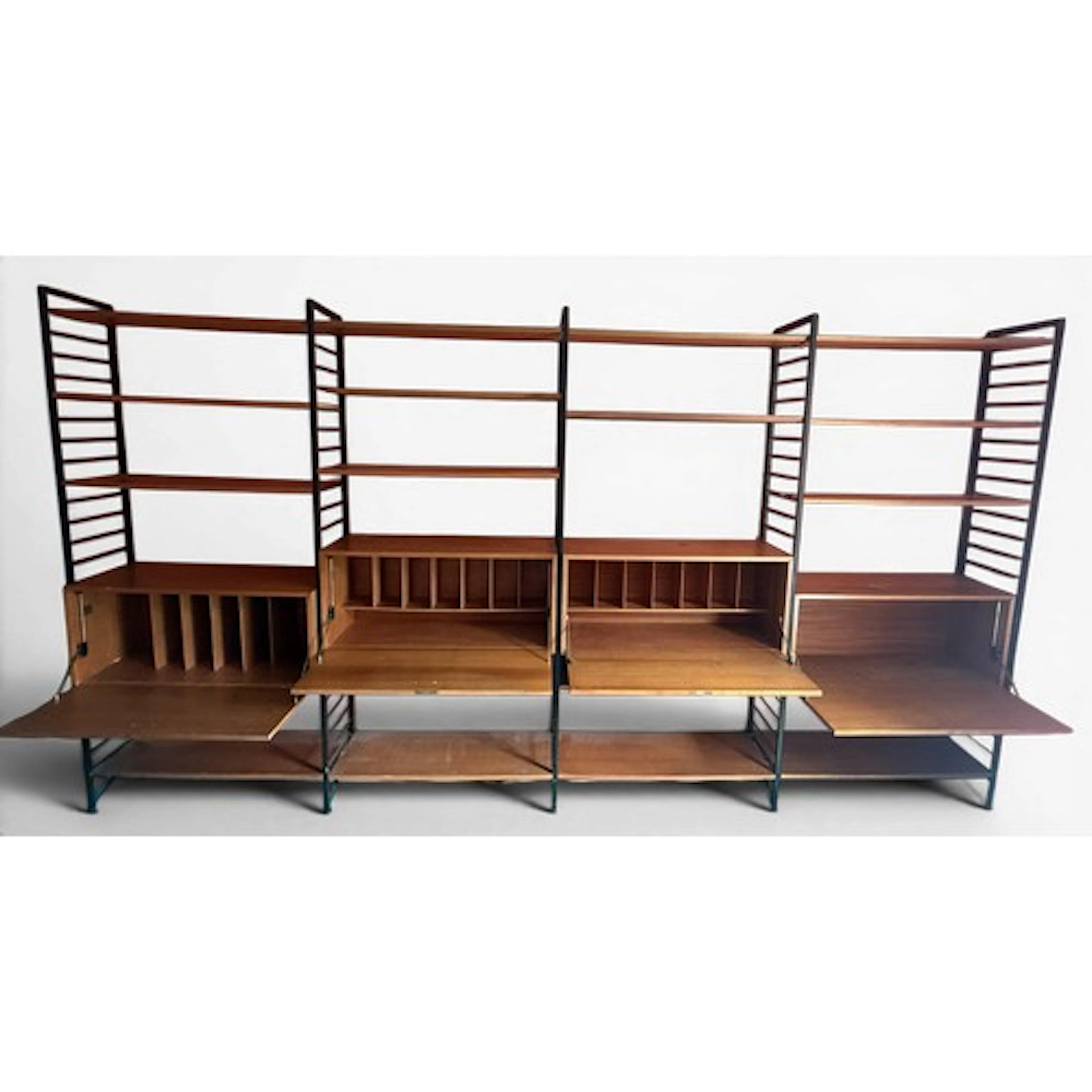 A mid-century teak and black metal Ladderax Staples unit. to...