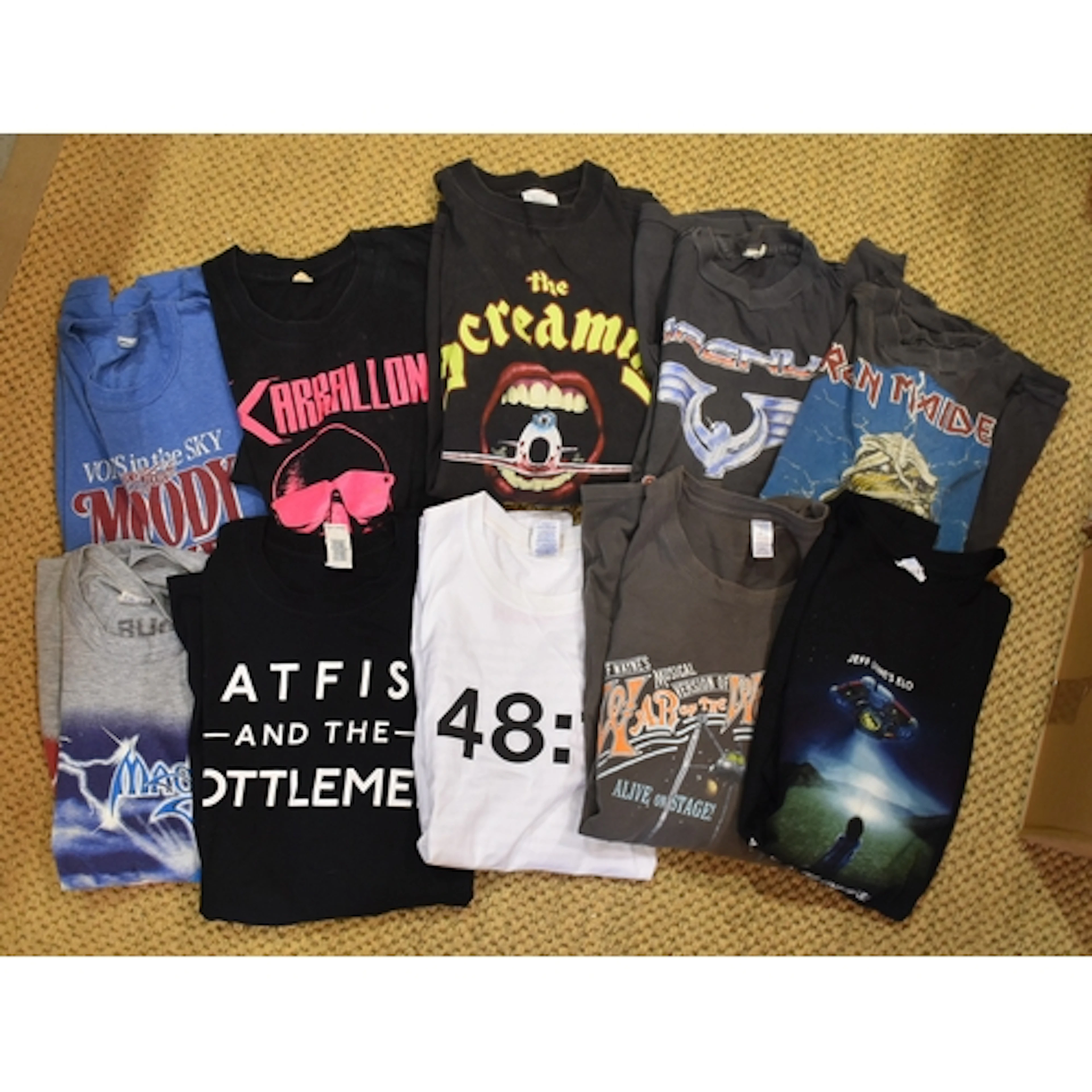 A collection of approximately forty various tour T-shirts, i...