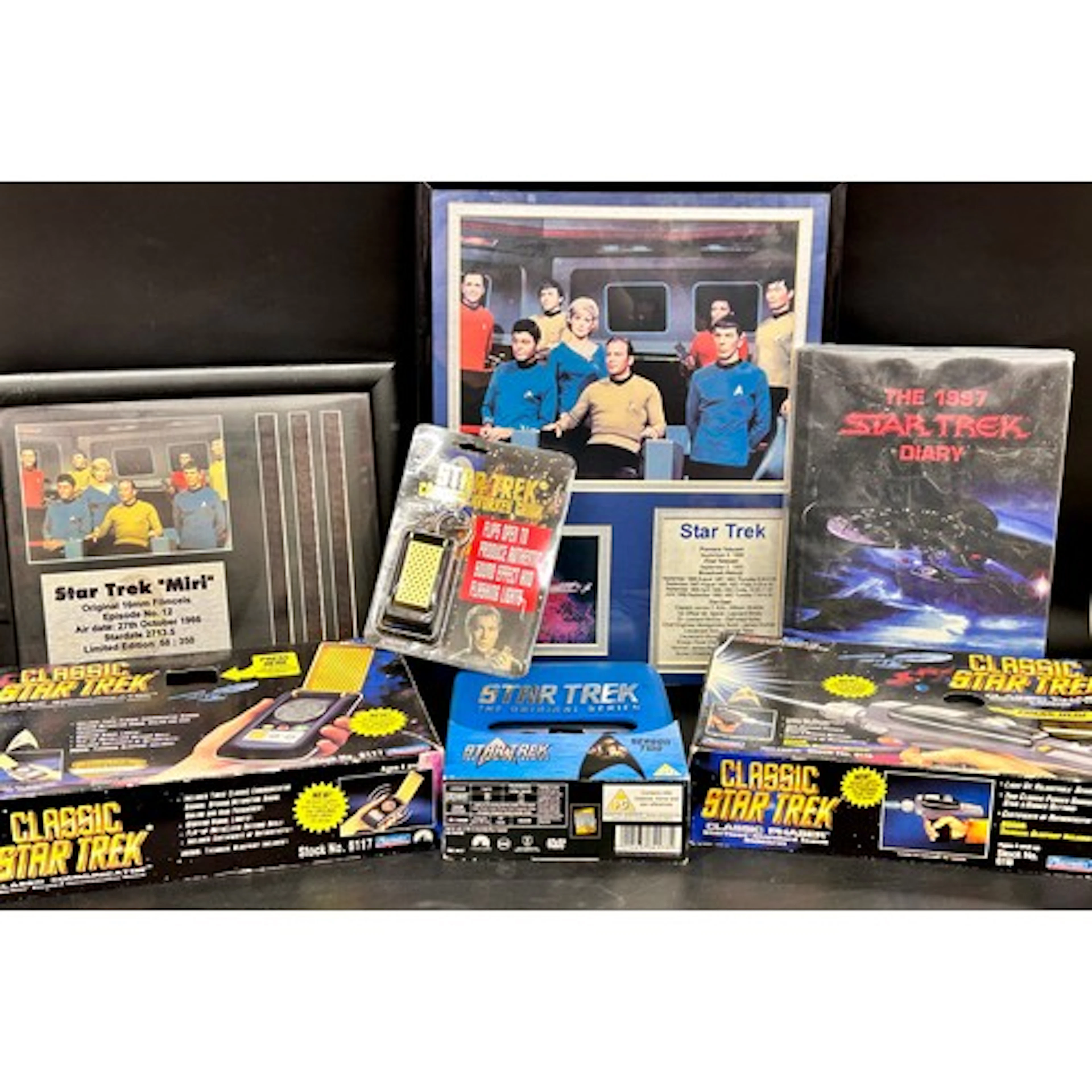 A collection of vintage Star Trek toys including Classic Pha...