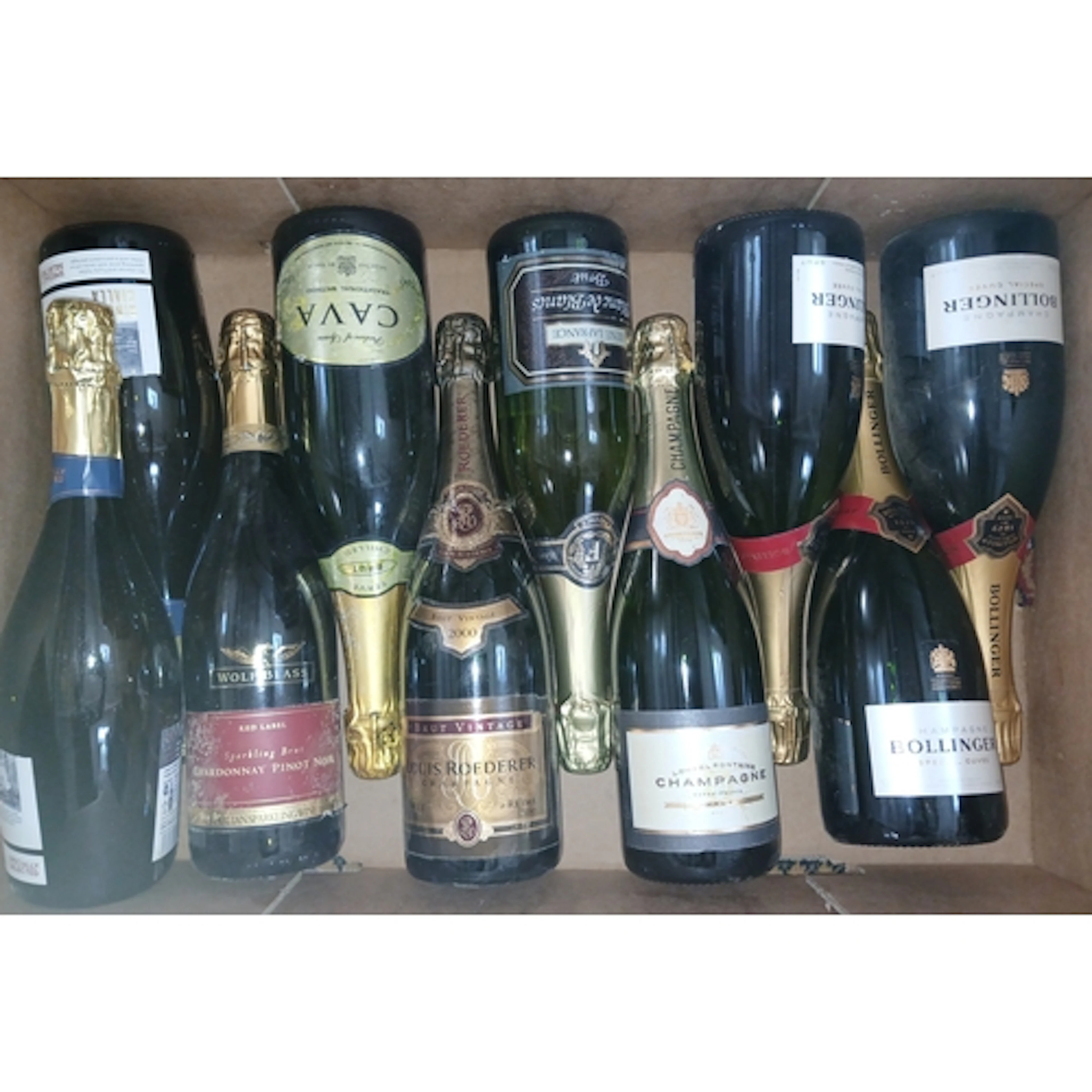 Nine bottles of assorted sparkling wine.