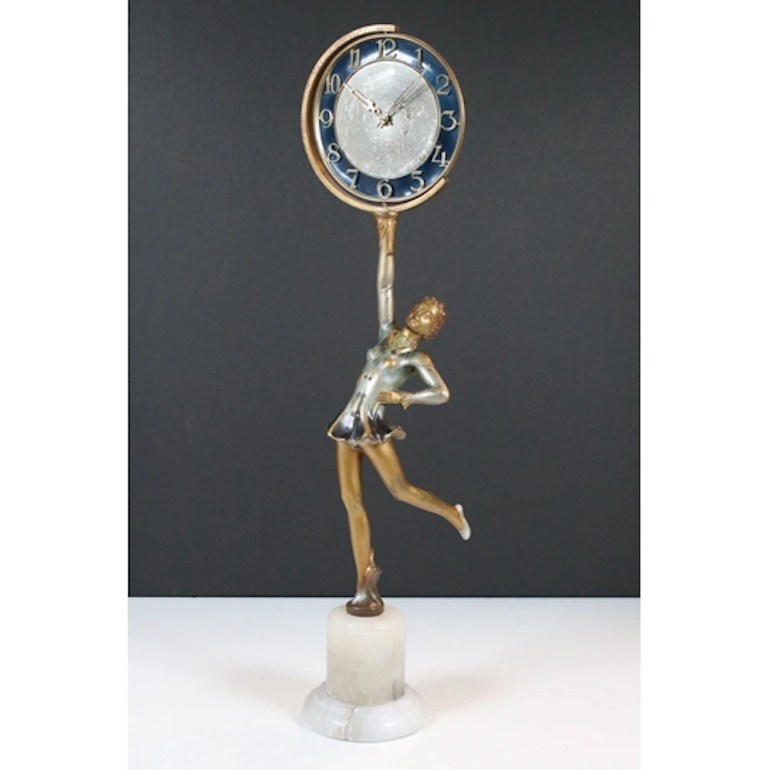 Art Deco figural clock, modelled as a woman holding the circ...