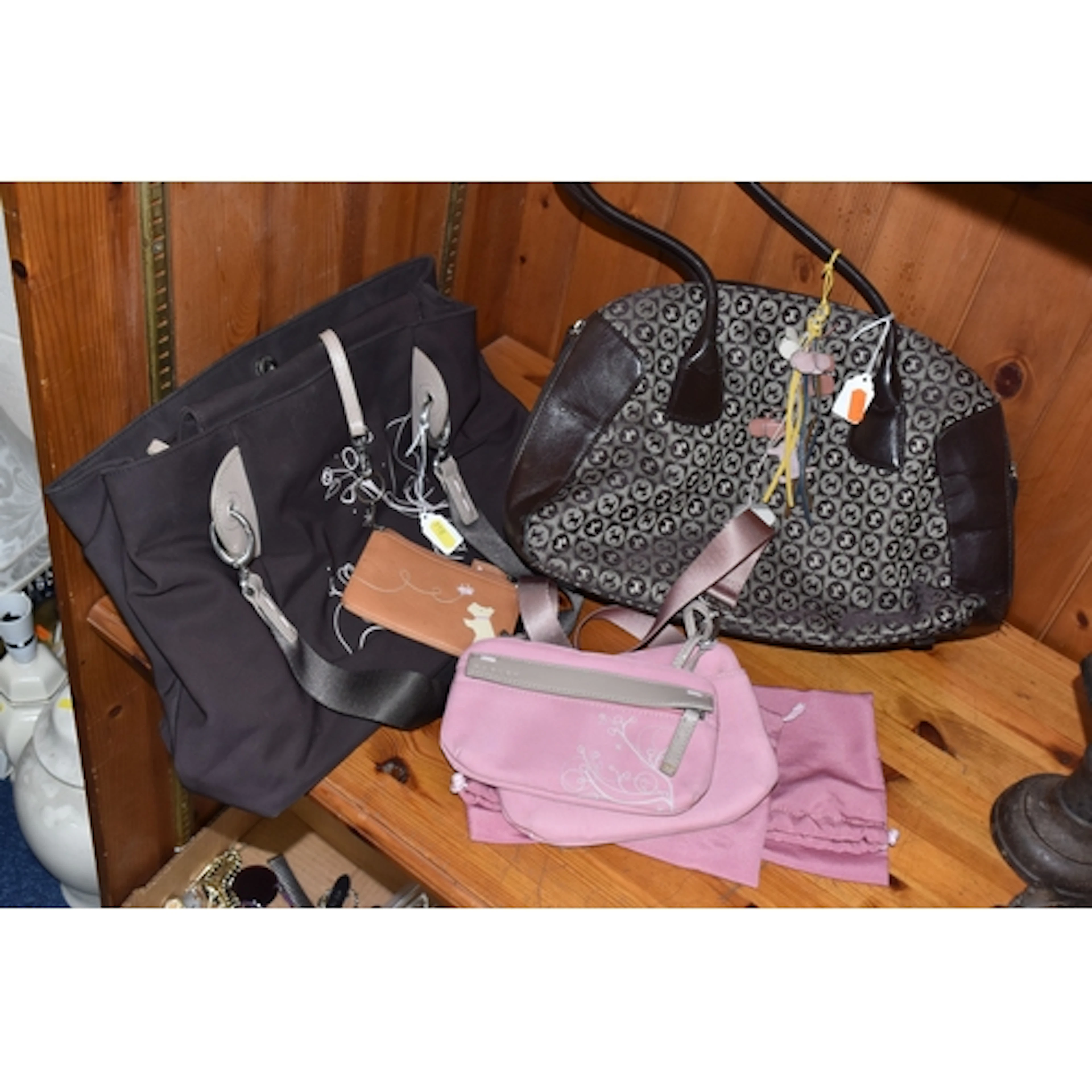 A GROUP OF RADLEY HANDBAGS, comprising a brown handbag, the ...