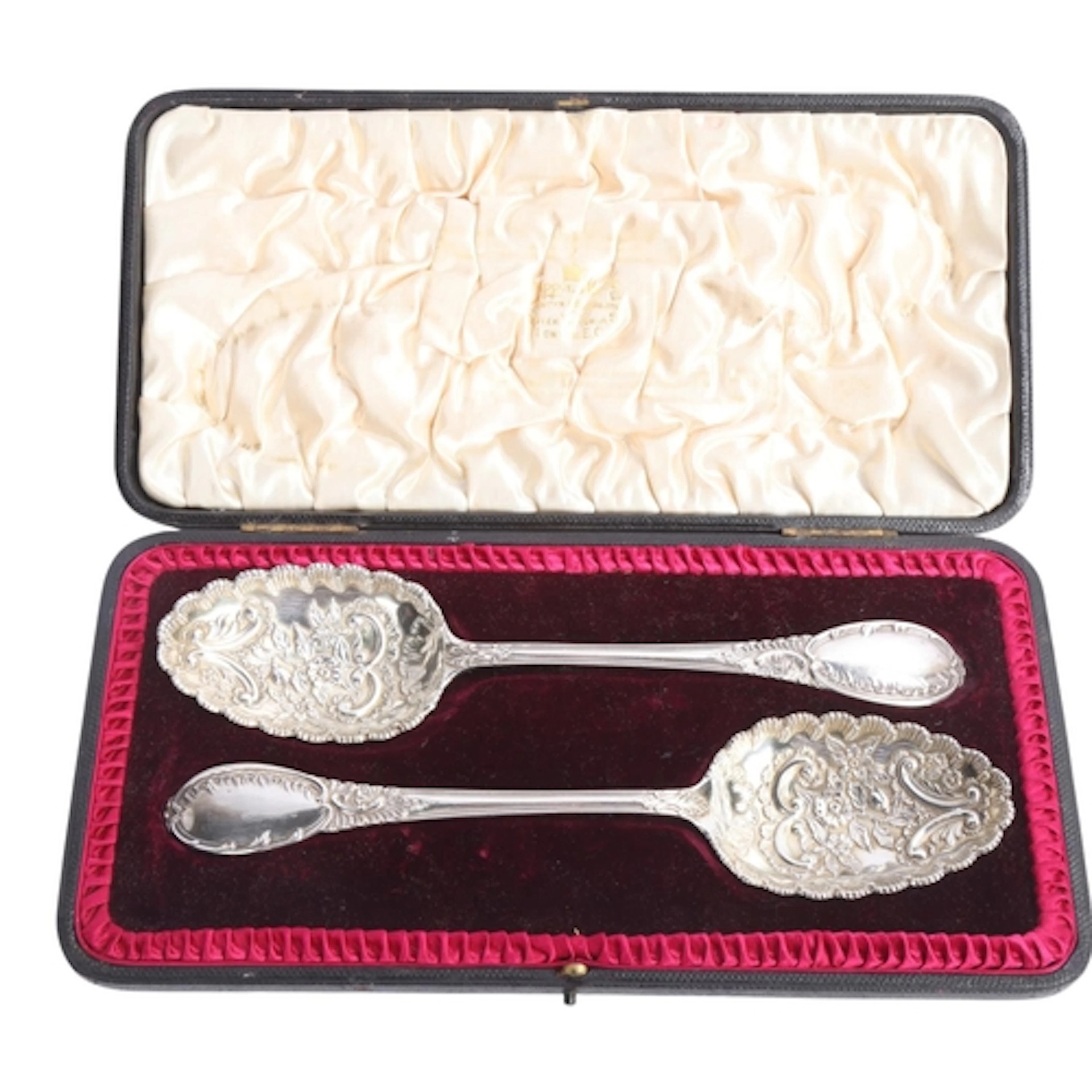 MAPPIN & WEBB LTD - a pair of Edwardian silver berry serving...