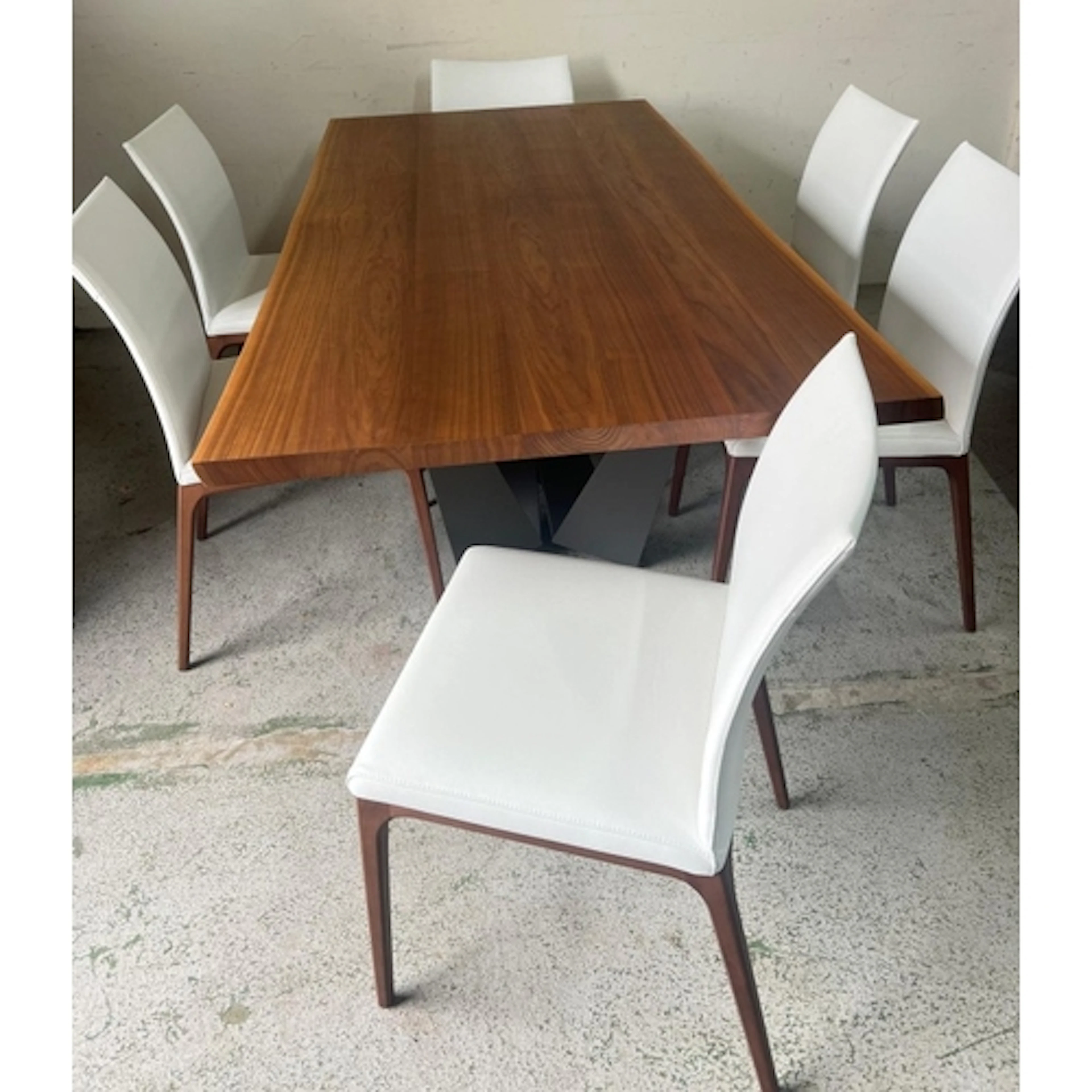 A Cattelan Italia dining table and six matching chairs uphol...