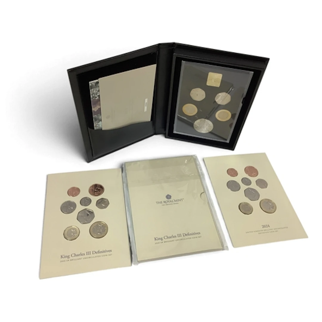 Four UK Royal Mint King Charles III Coin Sets, includes a 20...