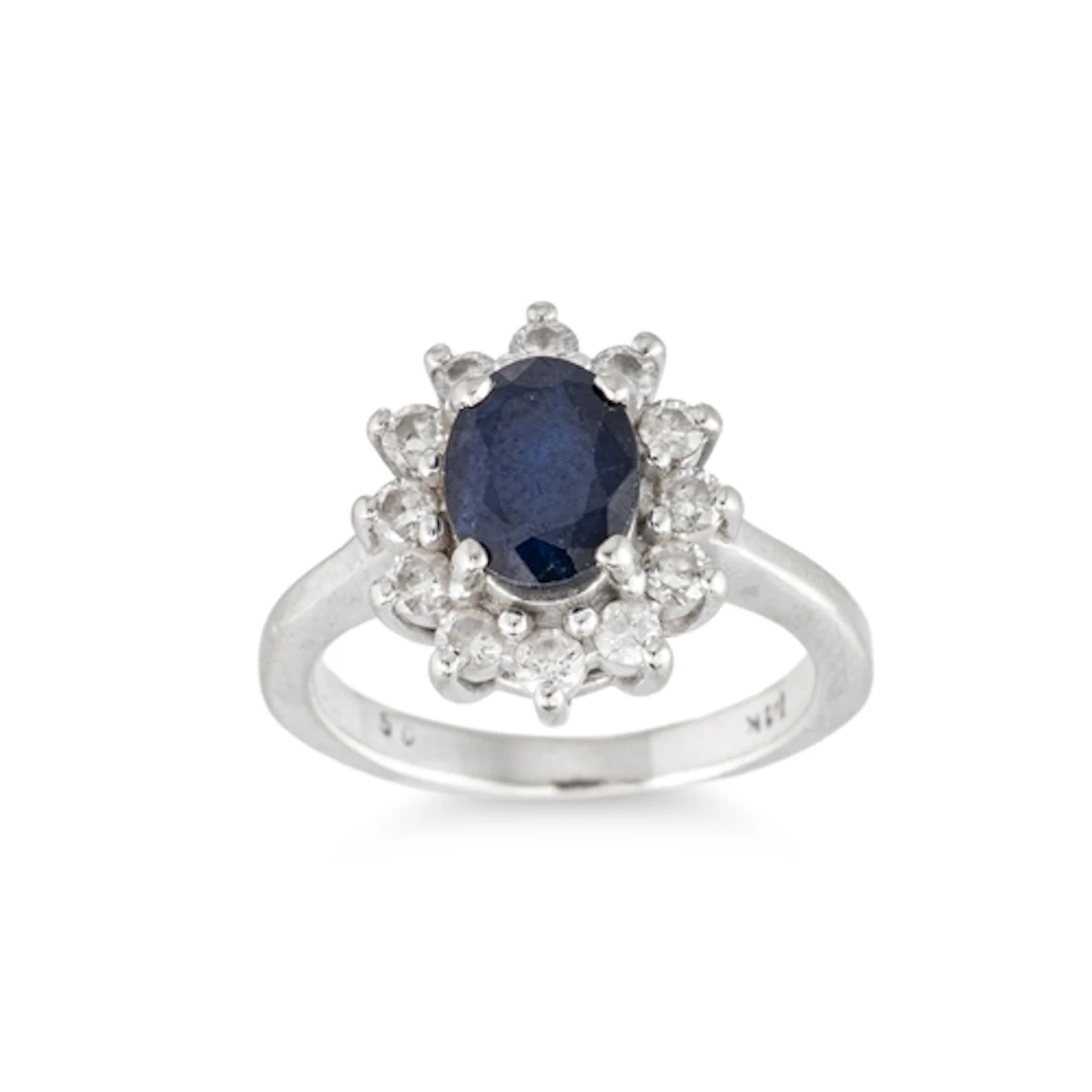 A SAPPHIRE AND DIAMOND CLUSTER RING, mounted in 14ct white g...