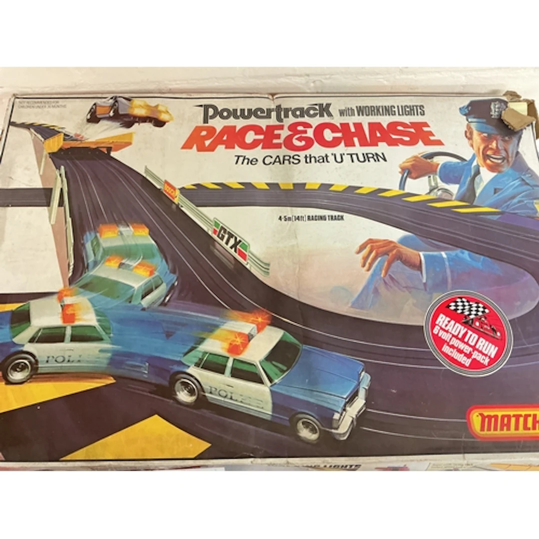 A Boxed Matchbox Race And Chase Set With 6 Extra Cars. No Re...