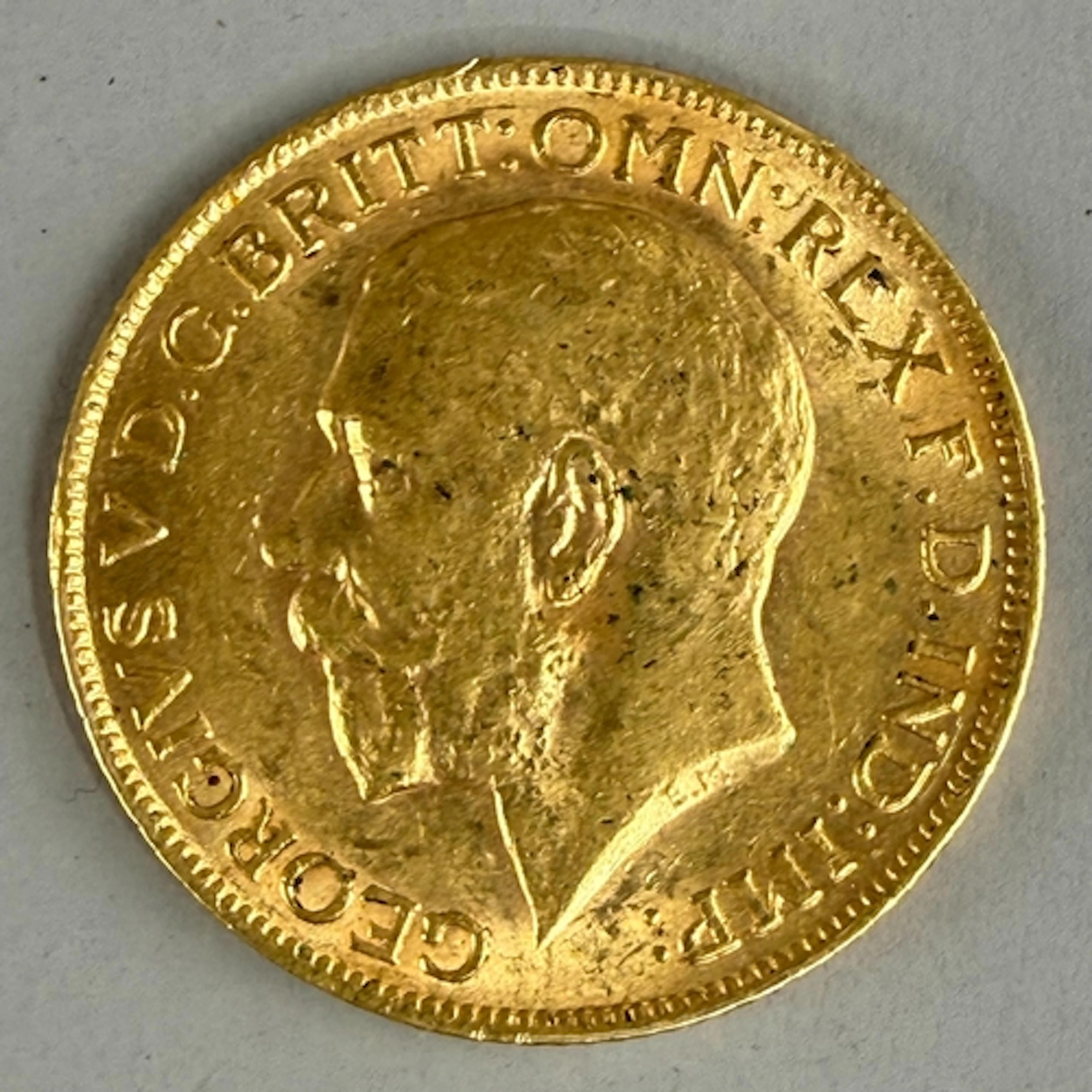 Coins: a 1912 George V gold full sovereign, circulated....