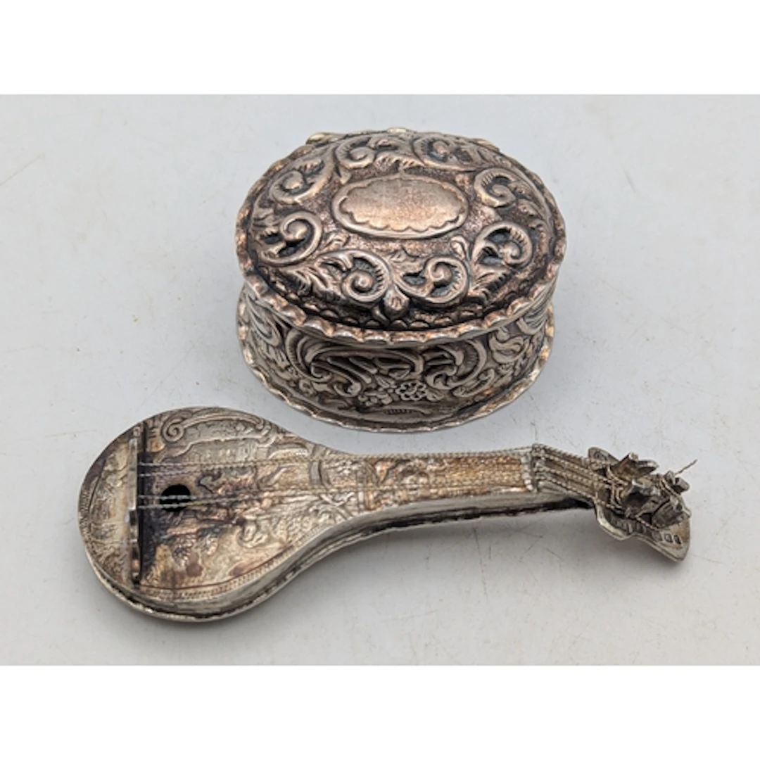 Silver collectables to include a miniature model of a mandol...