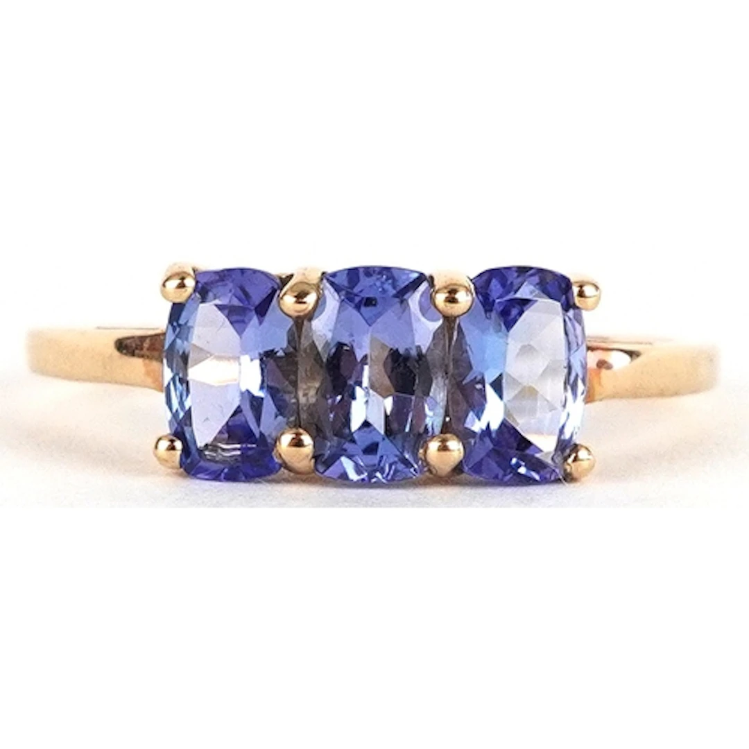 10K gold purple stone trilogy ring, possibly tanzanite, size...