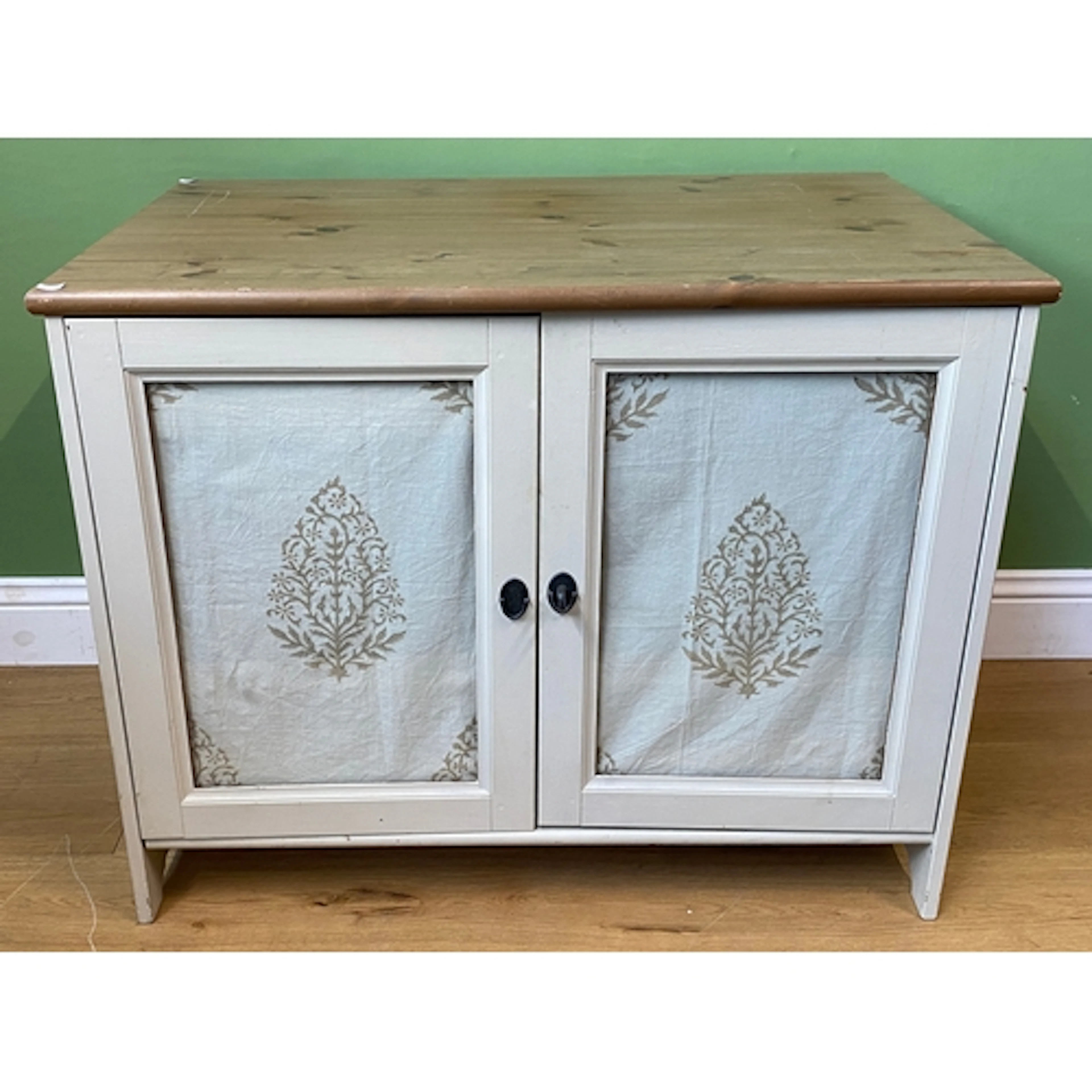 A white painted cupboard, pine top over a pair of glazed doo...