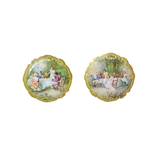 A LARGE PAIR OF 19TH CENTURY PORCELAIN CHARGER PLATES Painte...