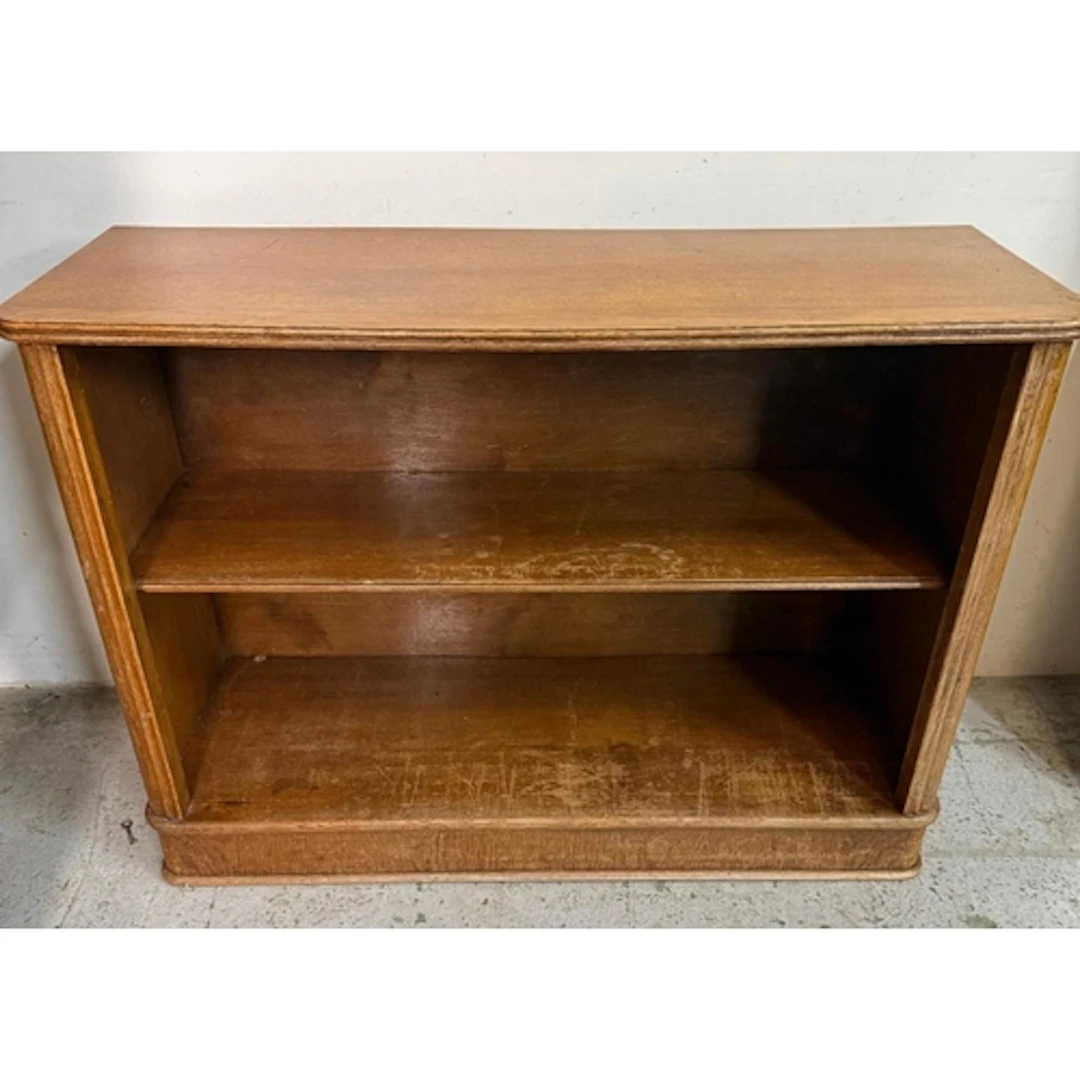 A light oak open bookcase with one central shelve