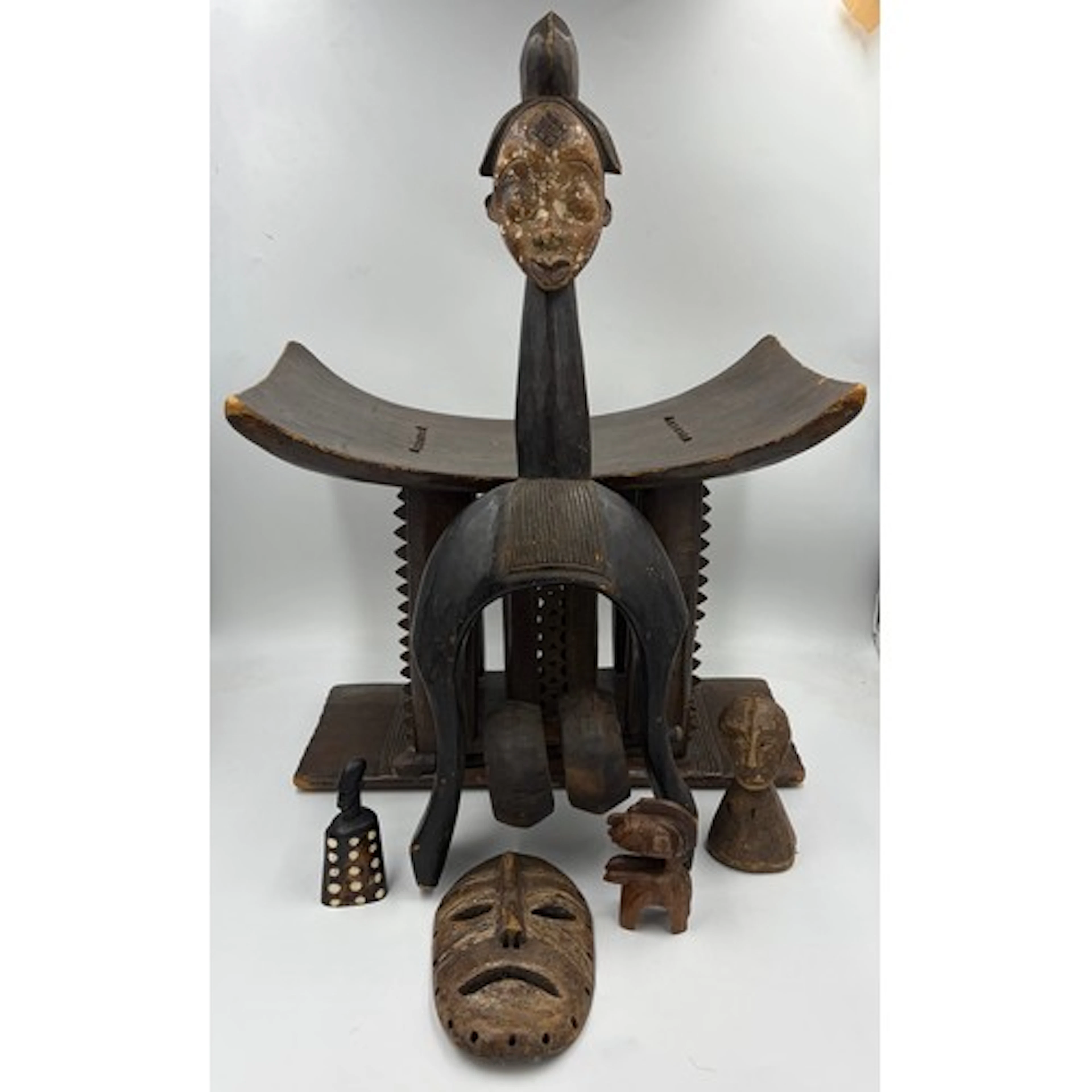 Collection of tribal artefacts to include Tsogo heddle pulle...