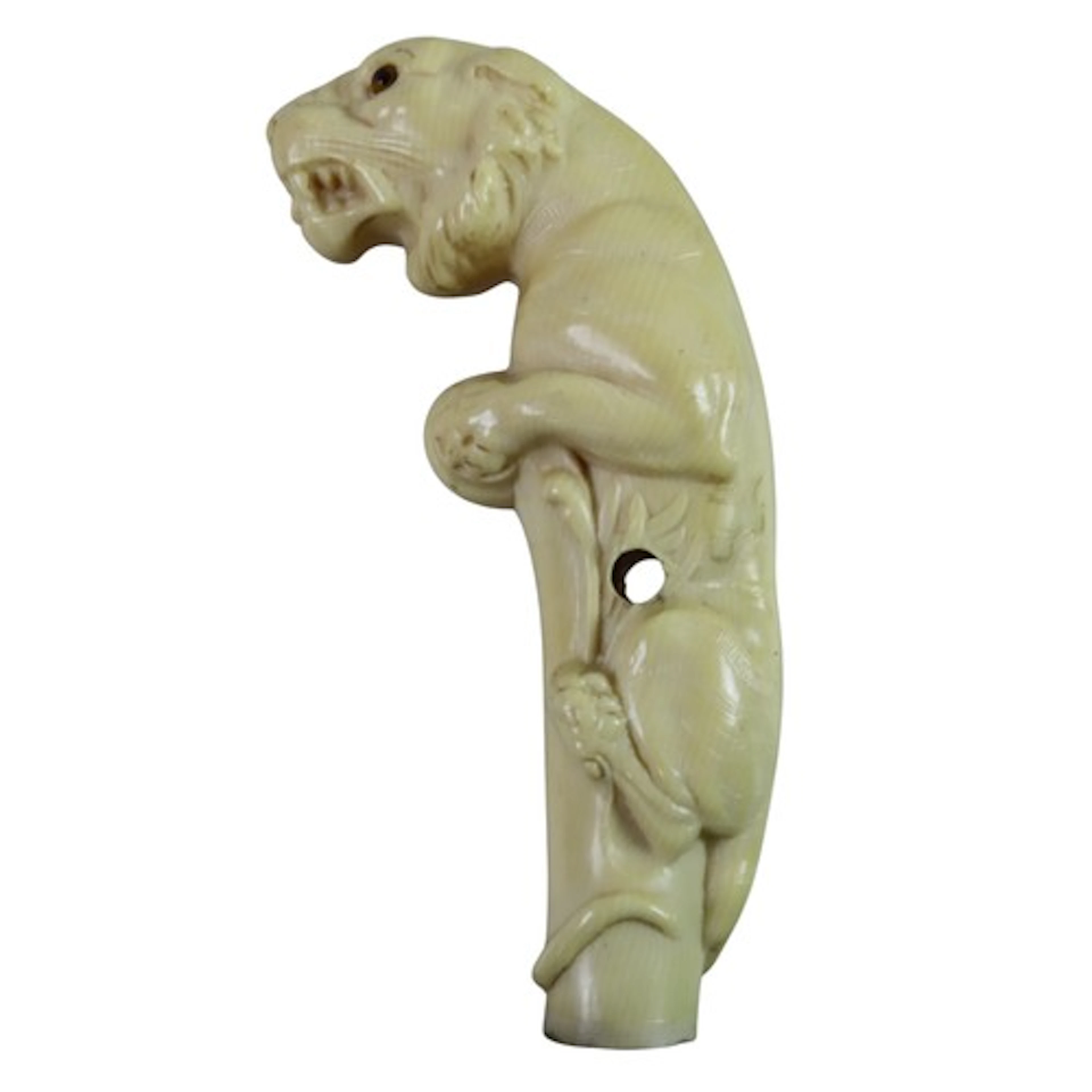 AN UNUSUAL MOULDED IVORINE WALKING HANDLE modelled as a tige...