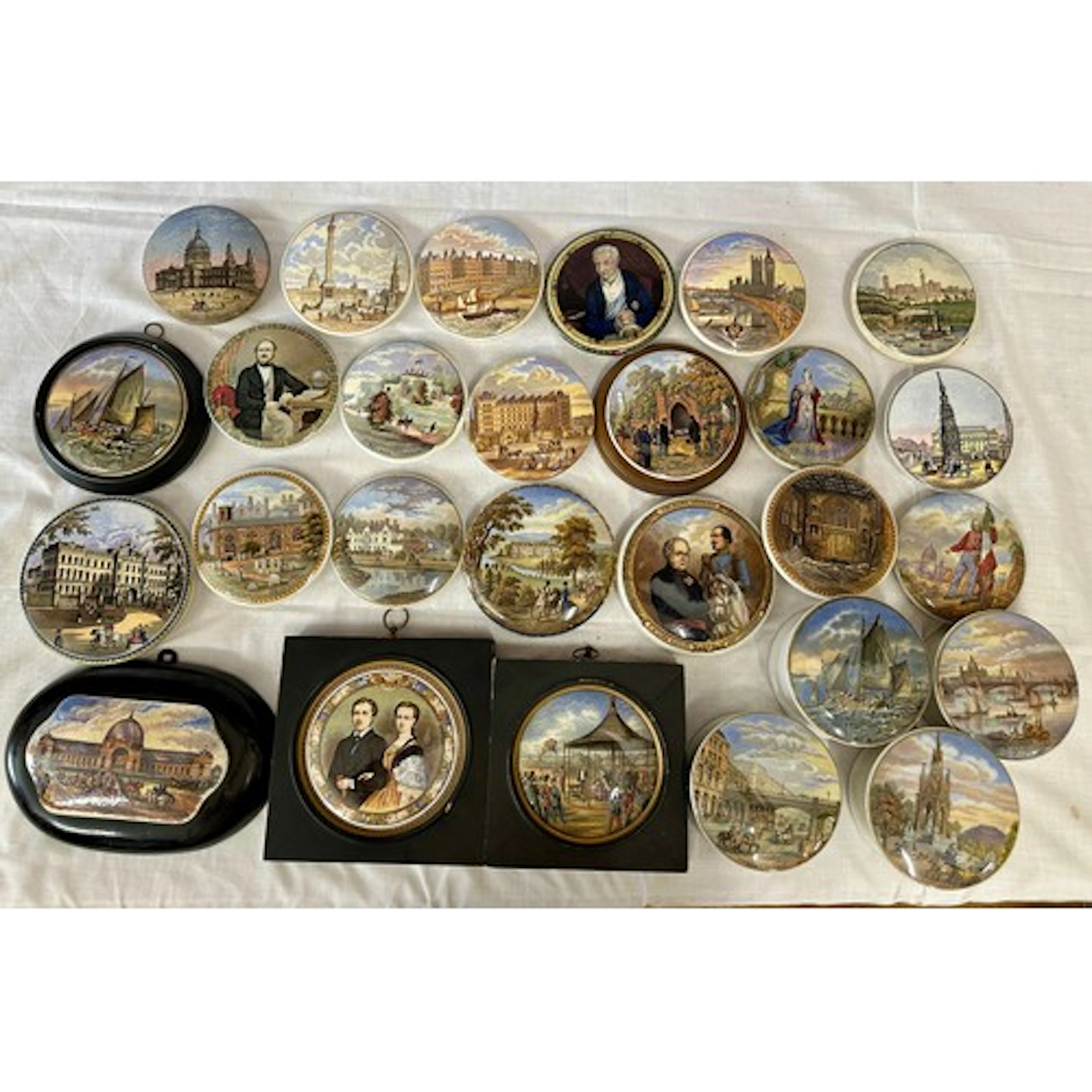 A collection of 19thC Prattware lids and pots consisting of ...
