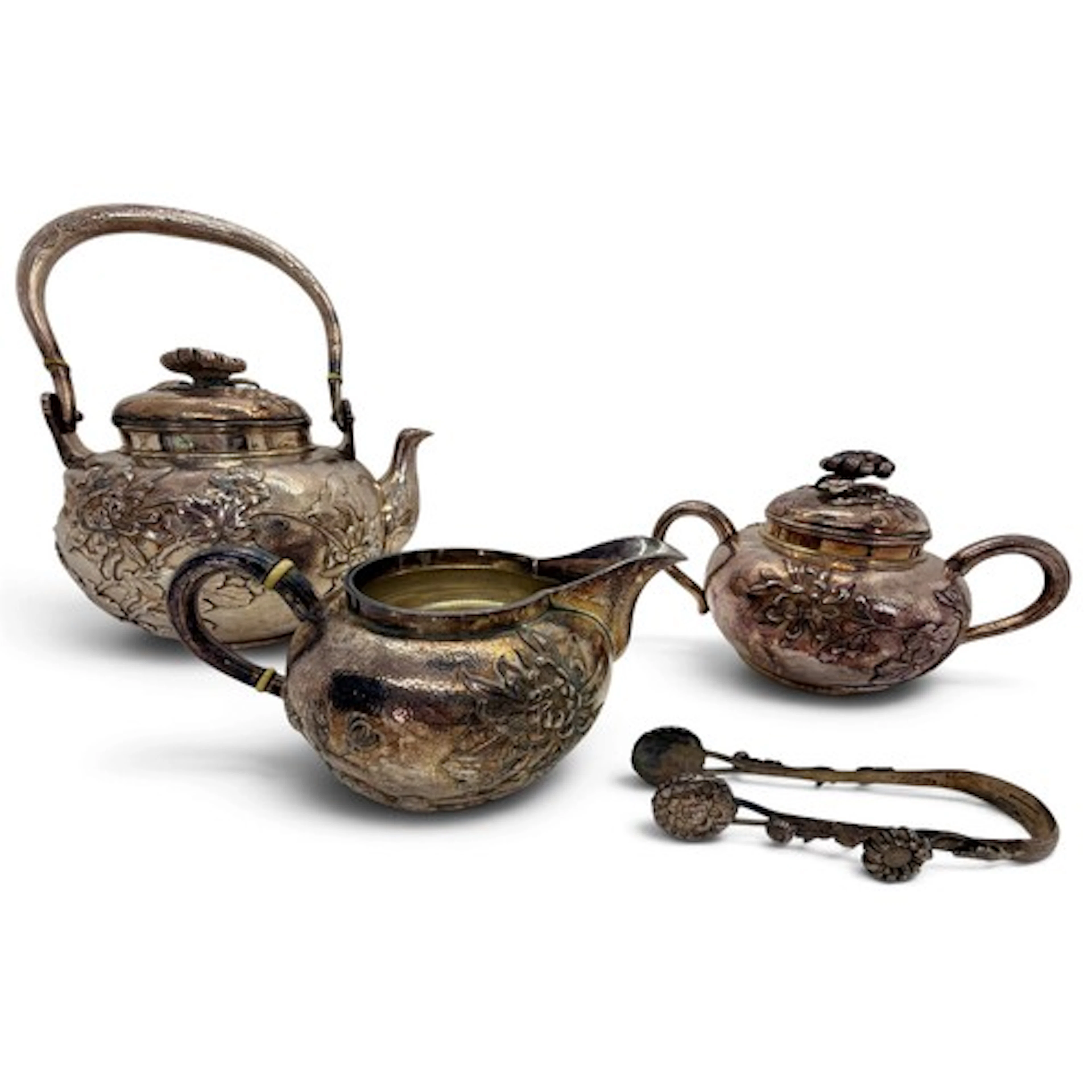 A fine Japanese silver four piece tea set, comprising bulbou...