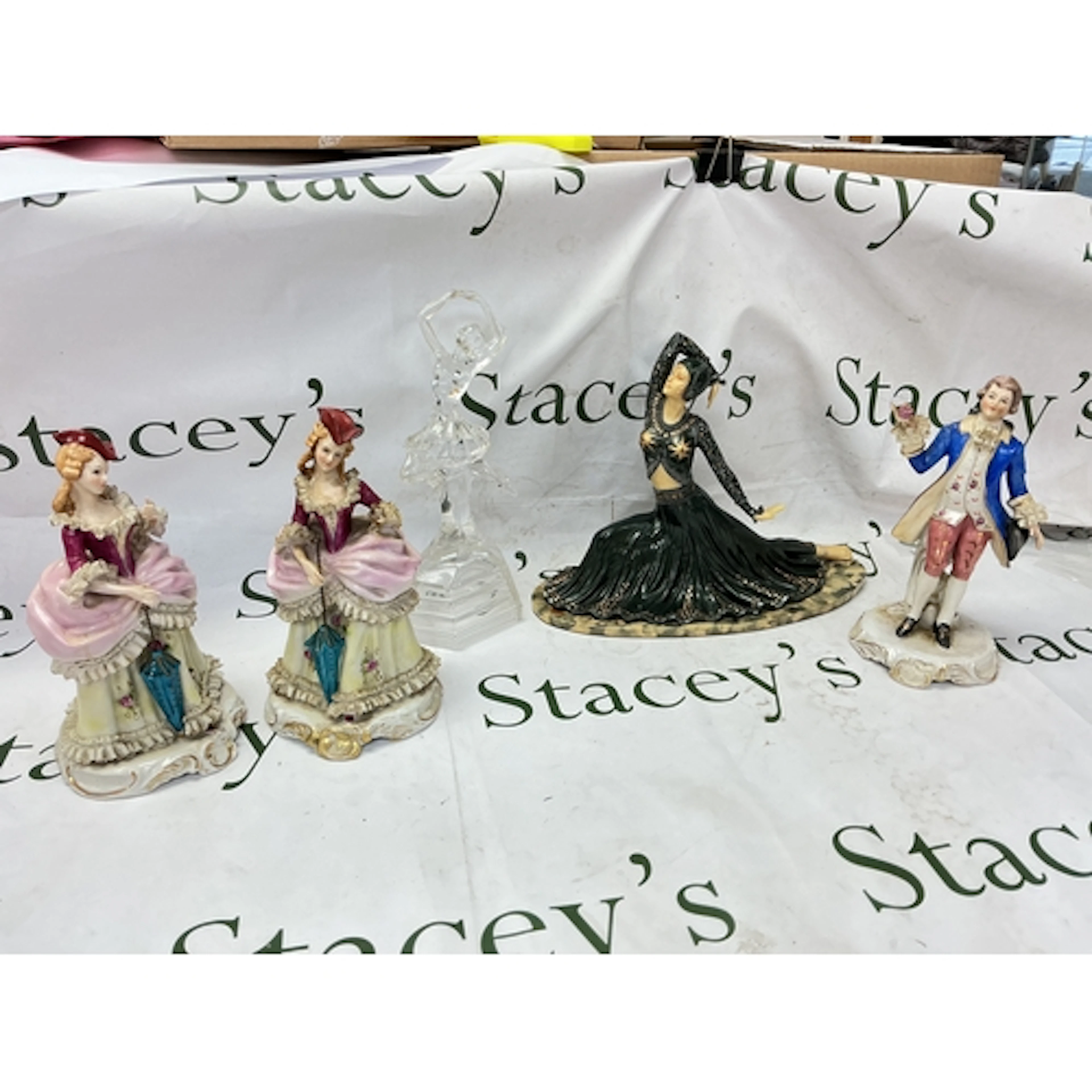 A collection of porcelain figures including Victorian style ...