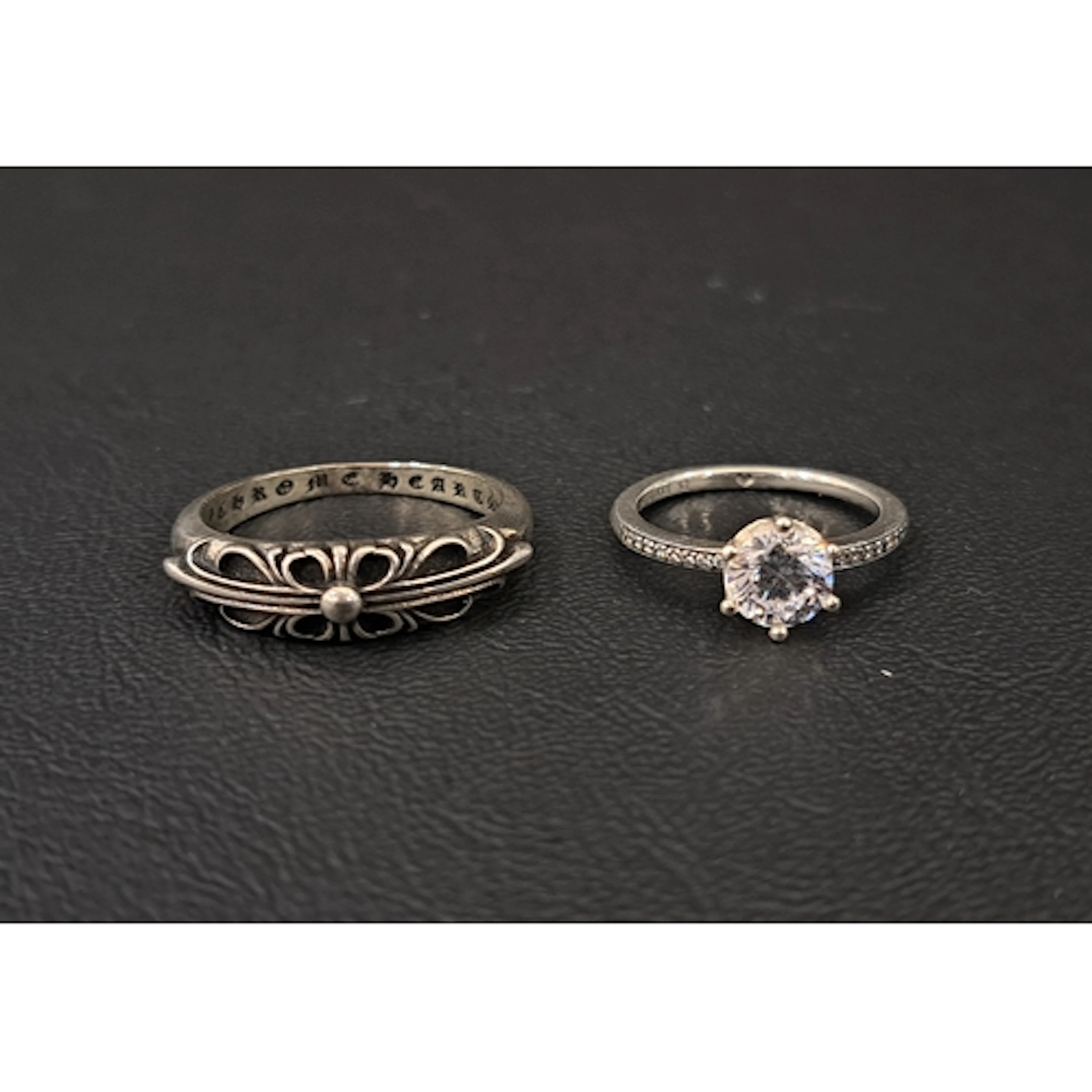 TWO FASHION JEWELLERY RINGS comprising a Chrome Hearts Silve...
