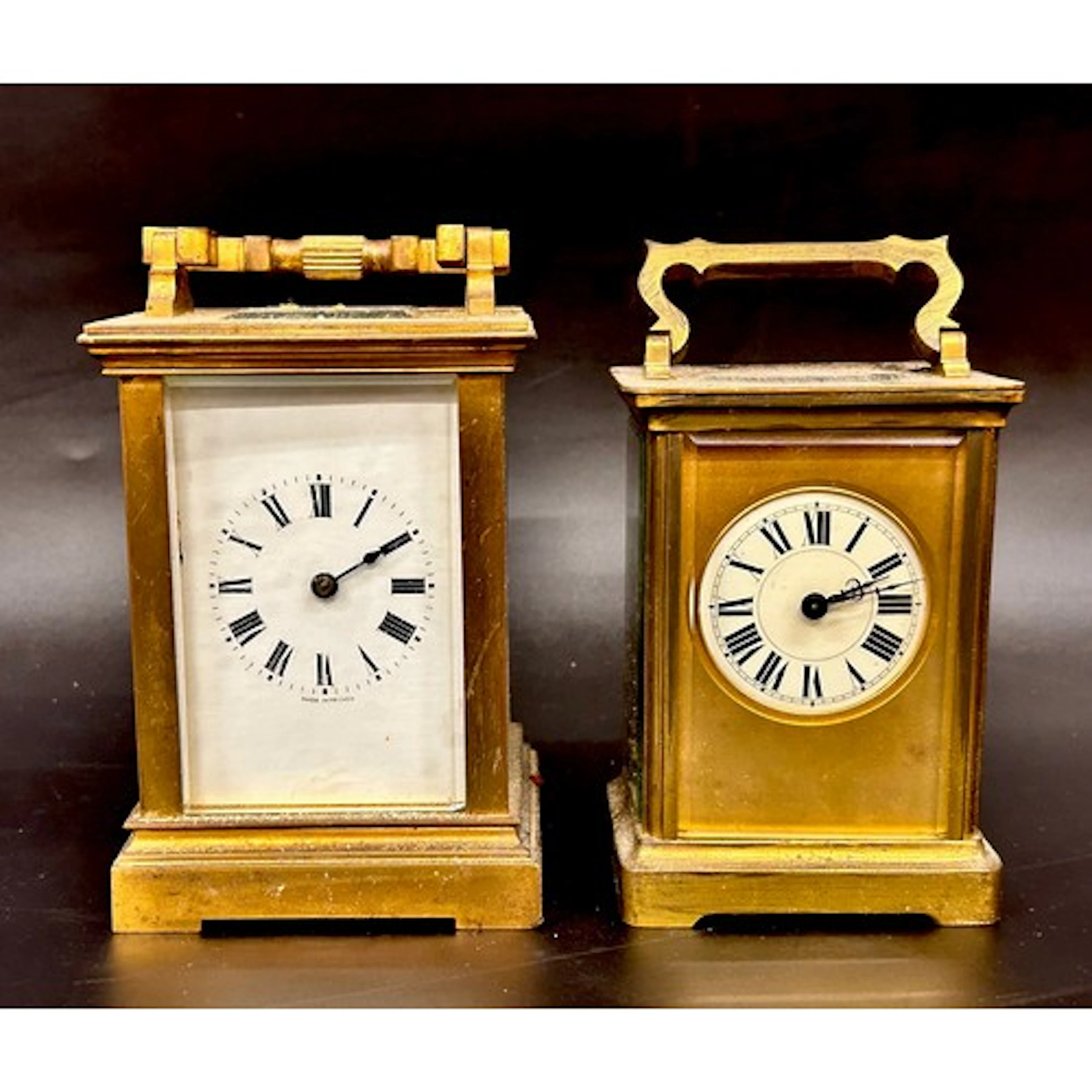 A French brass carriage clock with another, both with keys, ...