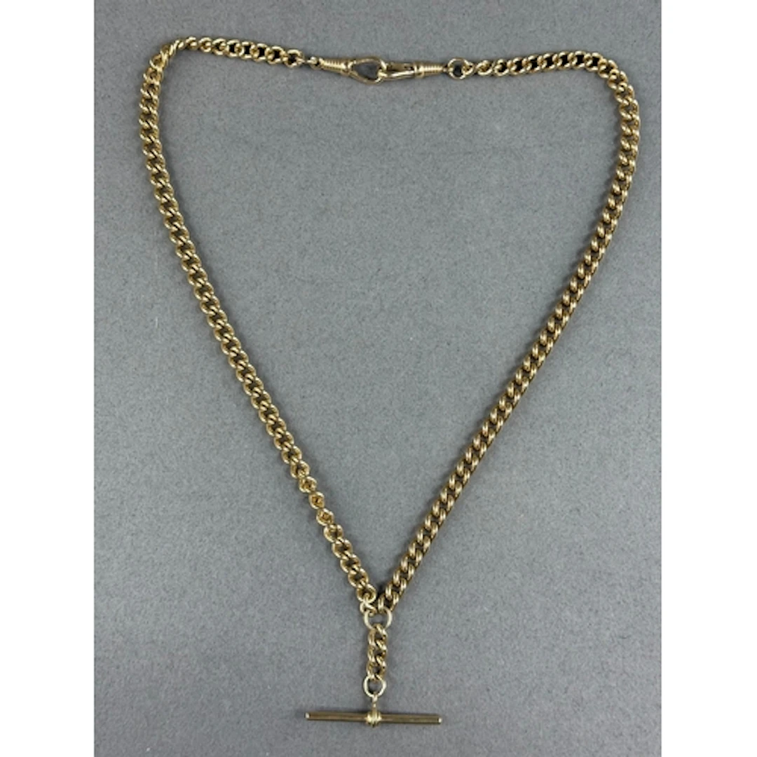 Jewellery: a yellow metal double Albert pocket watch chain, ...