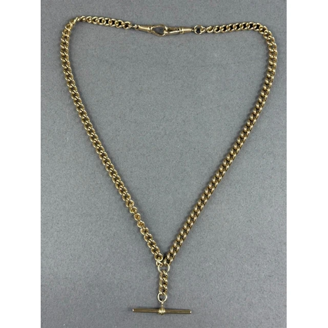 Jewellery: a yellow metal double Albert pocket watch chain, ...