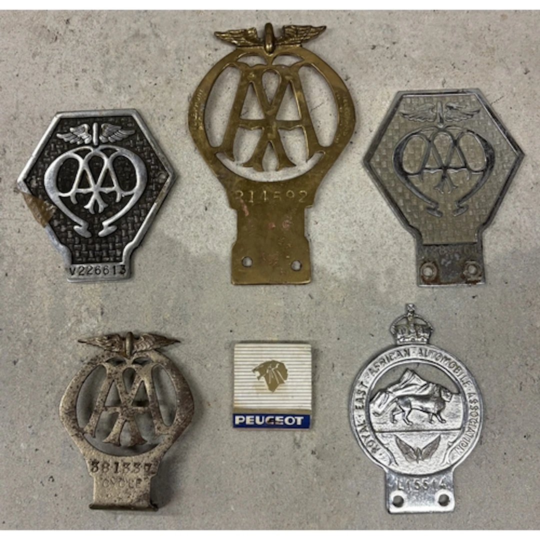 A pre 1930 AA motorcycle badge together with a brass AA badg...